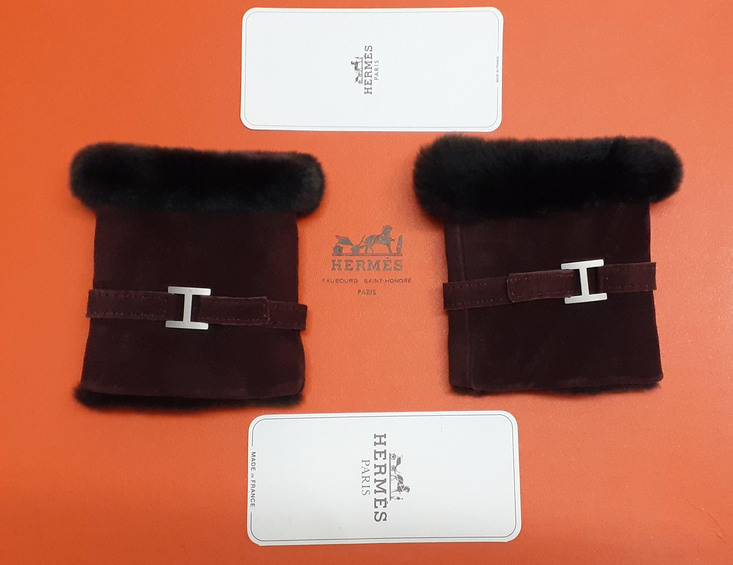 Warm and Cozy Authentic Hermès Wrist Warmers

Removable Muffs

Made of Leather and Fur

Probably vintage items, given the Hermès cards

Adorned by an H in silver-tone metal

Colorways: Deep Burgundy Leather / Black Fur

Super soft, a dream to