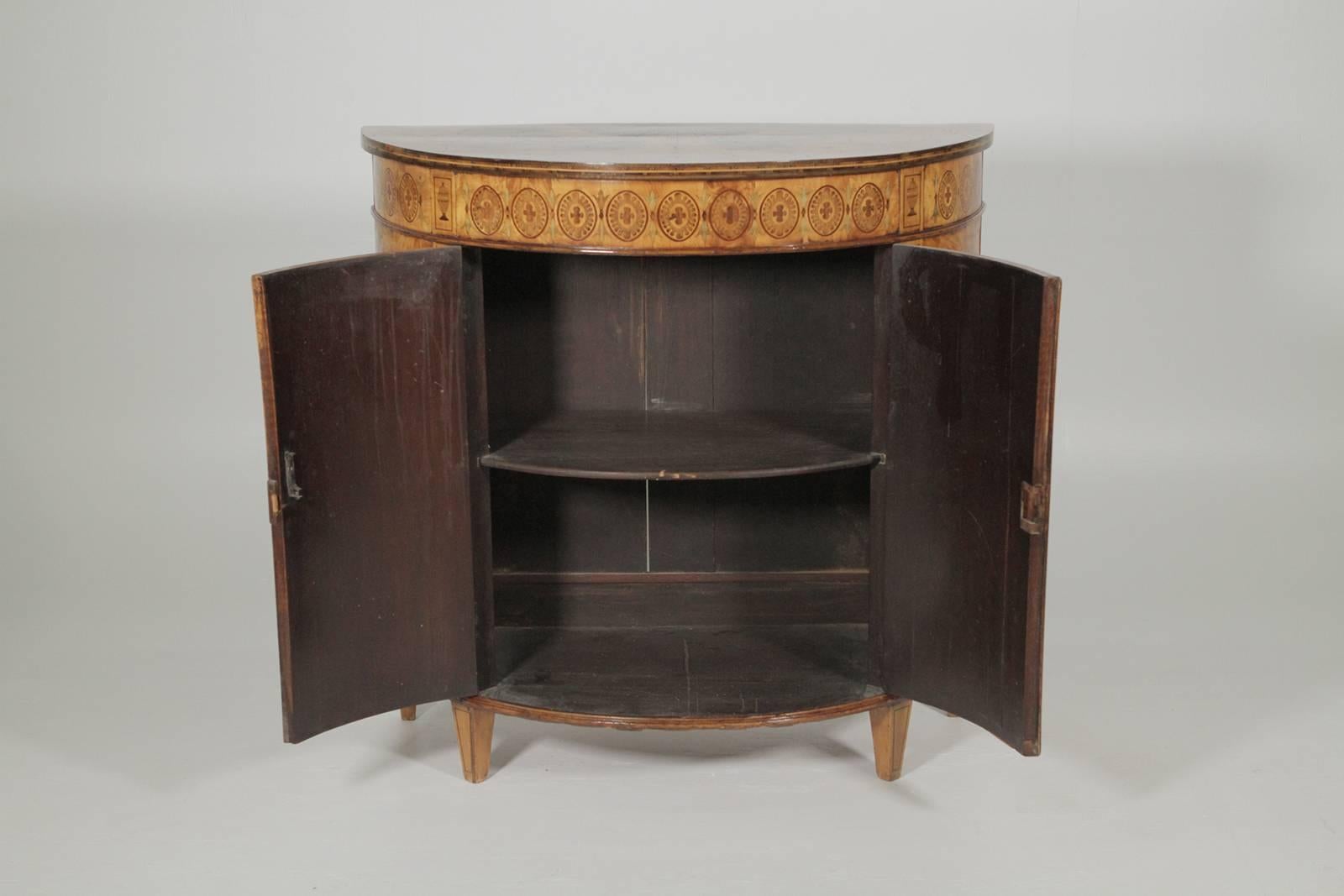 Exceptional inlaid circa 19th century commode expertly inlaid with exotic woods, the case with book matched figurative wood top with vignettes of female vestals, the lower case with four inlaid urns all on raised tapering feet.