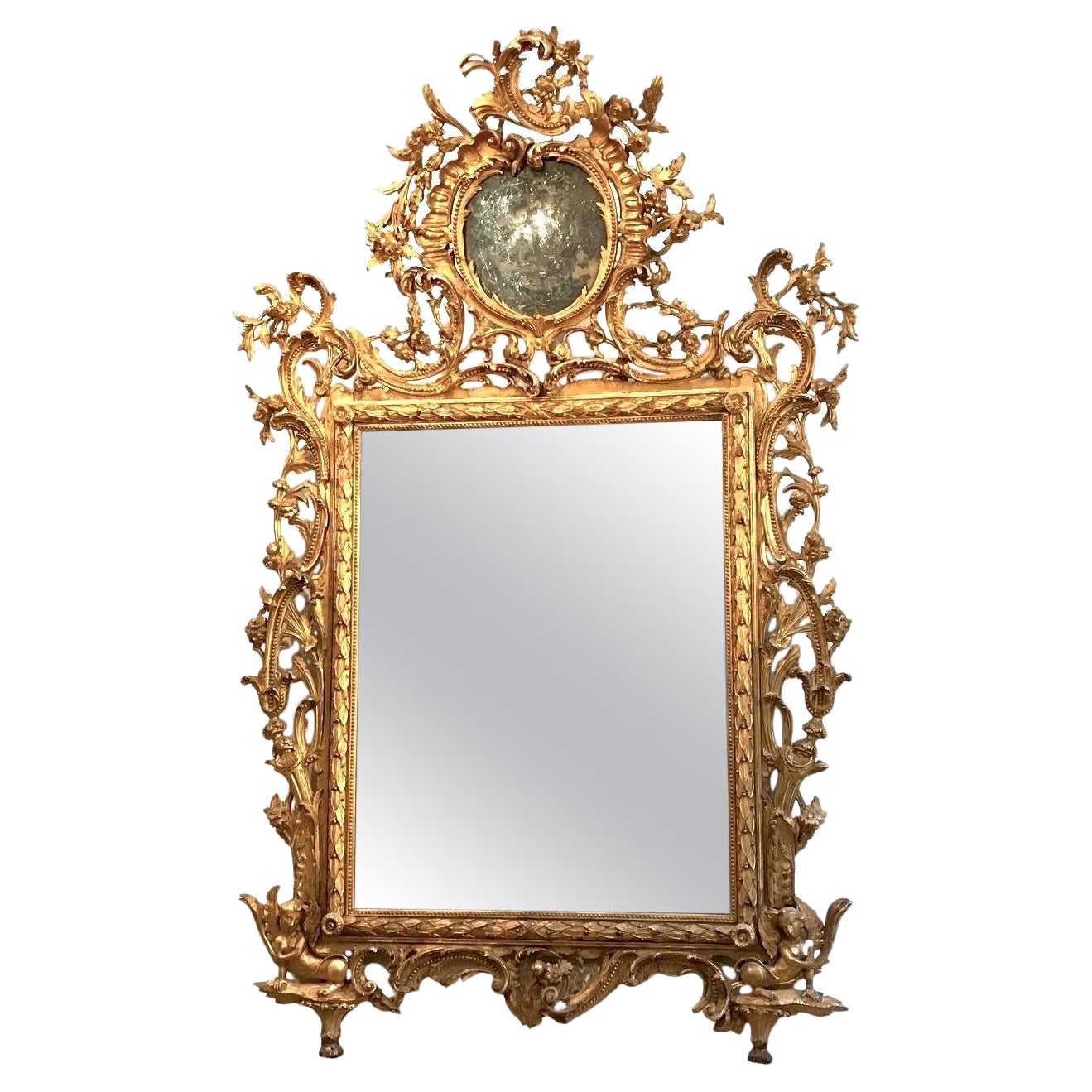 Excepcional espejo italiano del siglo XVIII tallado en madera dorada Toscana 1740