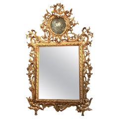 Eccezionale specchio italiano del 18° secolo intagliato in legno dorato Toscana 1740