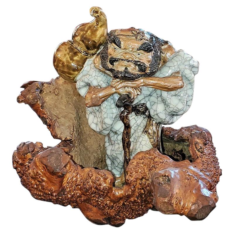 Exceptional Japanese Ceramic Figure in Knotted Wooden Stand