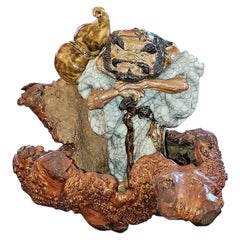 Exceptional Japanese Ceramic Figure in Knotted Wooden Stand