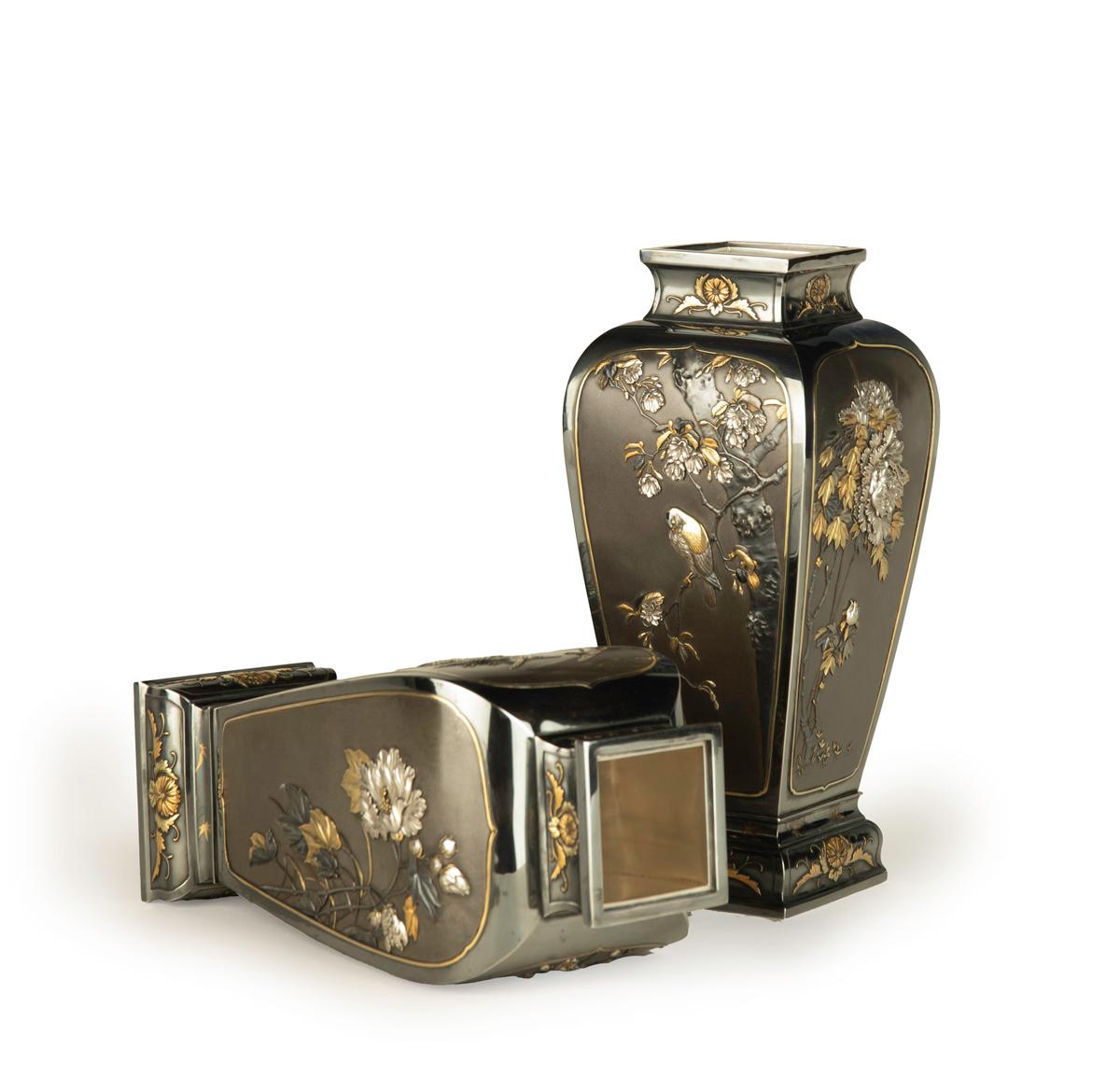 As part of our Japanese works of art exhibition we are delighted to offer this exceptional quality pair of Meiji Period (1868-1912)  mixed metal vases. The vases are formed from pure silver with each vase housing four shaped shibuichi panels