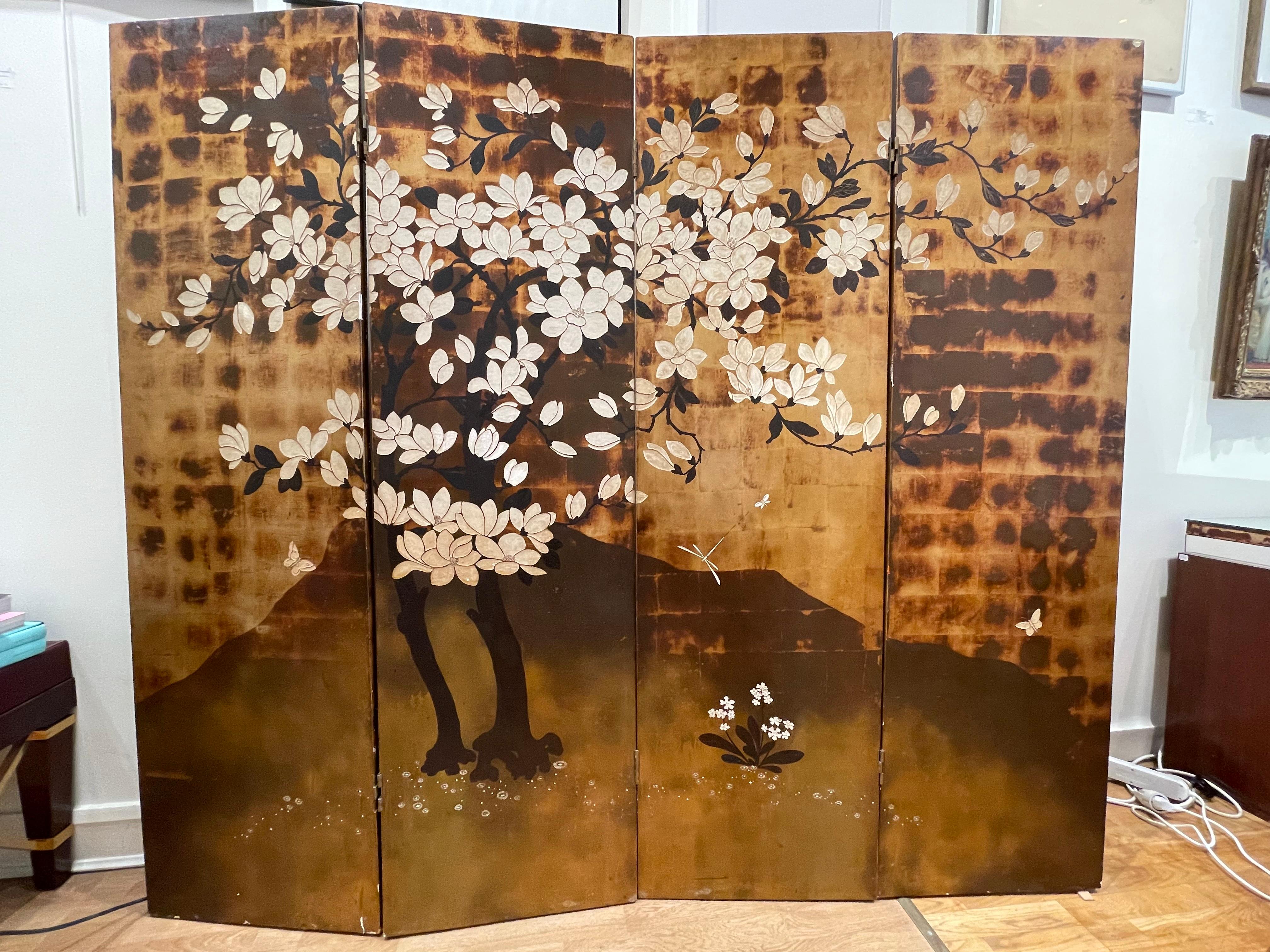 Exceptional 2-sided 4-panel lacquered screen by Pierre Bobot (French 1902-1974). Art Deco.
One side in color lacquer on a background of golded leaf with a decor of magnola flowers and insects. Signed and monogrammed bottom right.
On the back side,