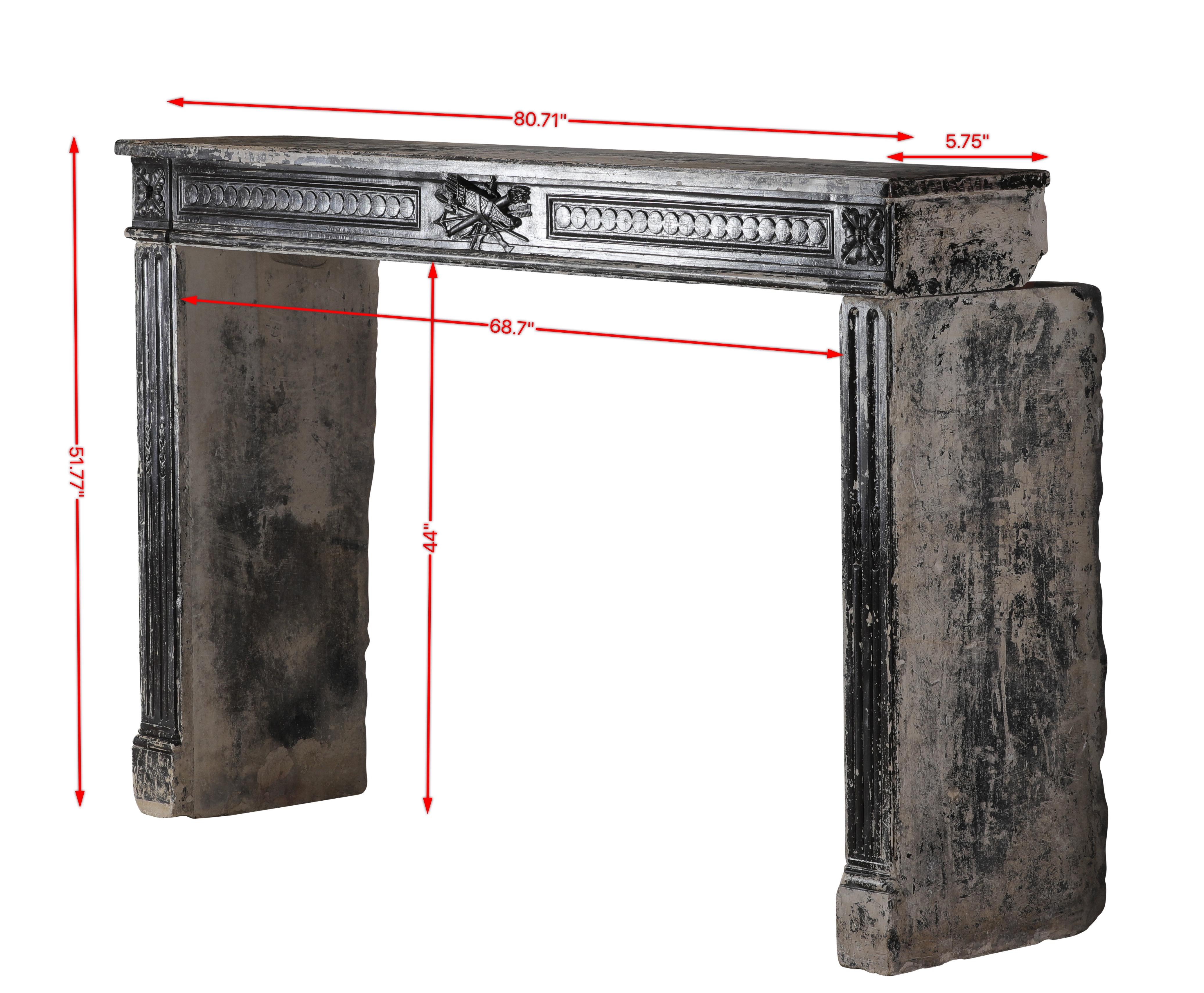 Exceptional and extremely large original French Directoire period limestone fireplace surround dating from the late 18th century hand-carved.
Its grand scale and refined neoclassical detailing reflect the transitional aesthetics between the Louis