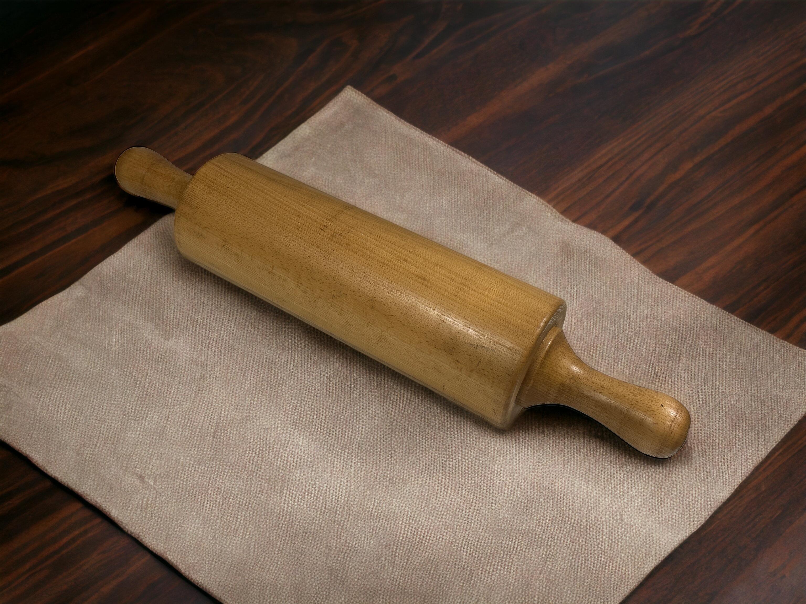 An amazing wooden rolling pin. This is a heavy bakery decoration item can also be used as a sculpture or center piece. It is in very good condition, some scratches but this is old-age. A nice addition to any room. Found at an estate sale in Vienna,
