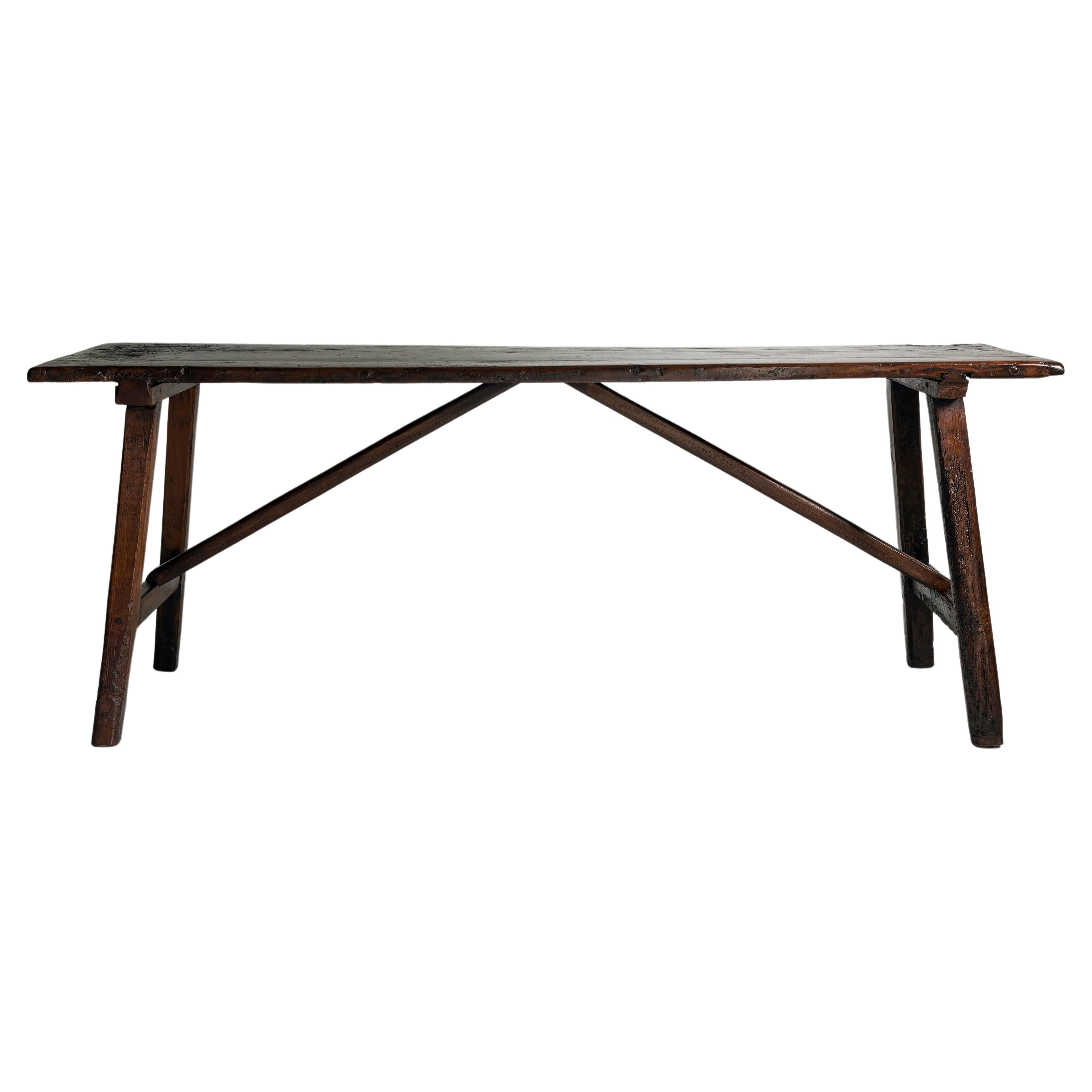 An exceptional 18th century Italian convent table, the table top made of one solid plank of Walnut.
A beautifully patinated table with great visual impact. Timeless and works in almost any setting. Perfect behind a sofa or as console in a hallway,