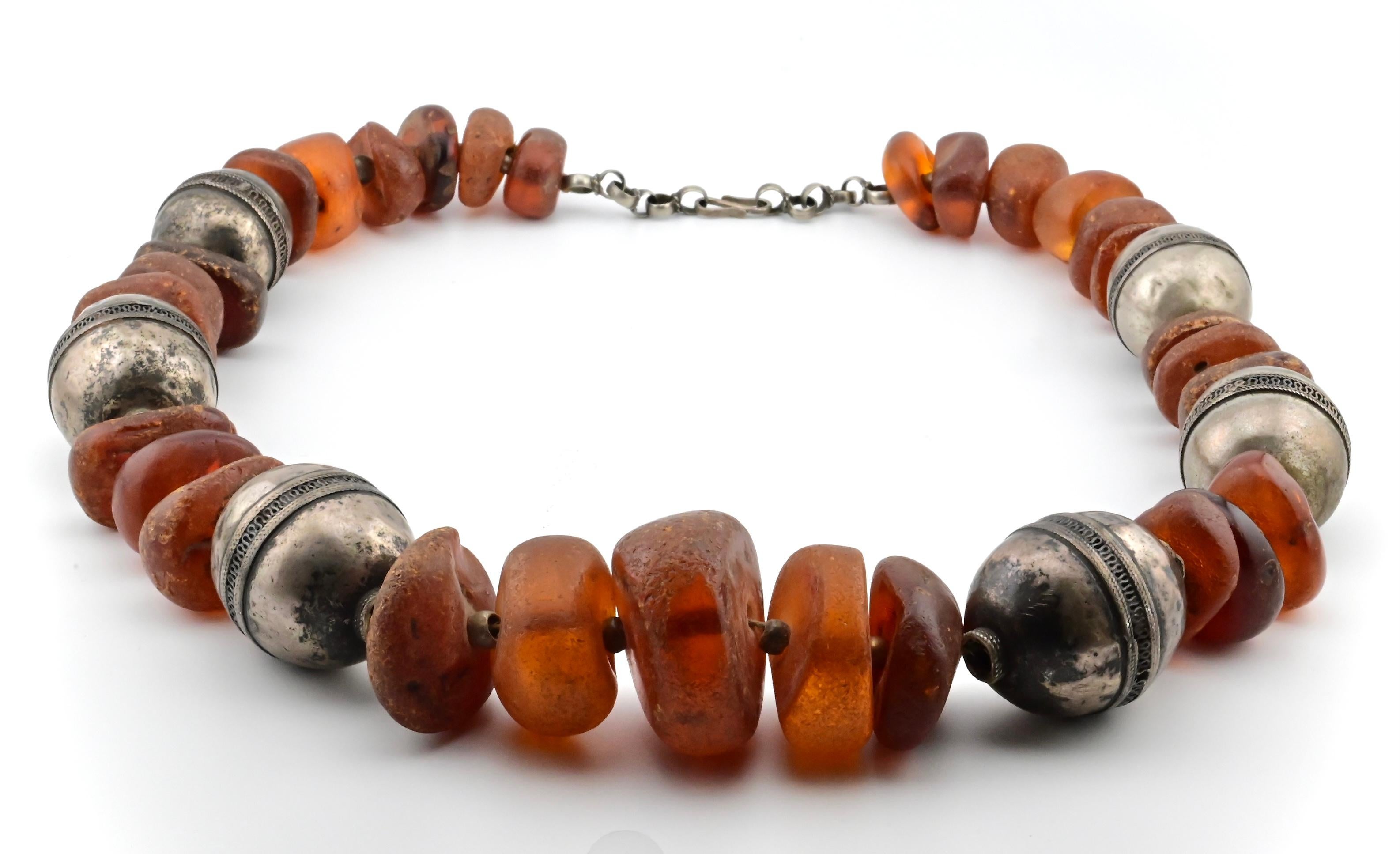 This is a stunning large chunk raw tumbled amber beaded necklace with silver separation beads. It weighs a total of 390 grams, and is 30 1/2 inches in length. It’s in beautiful condition, and If you have any questions or concerns please feel free to