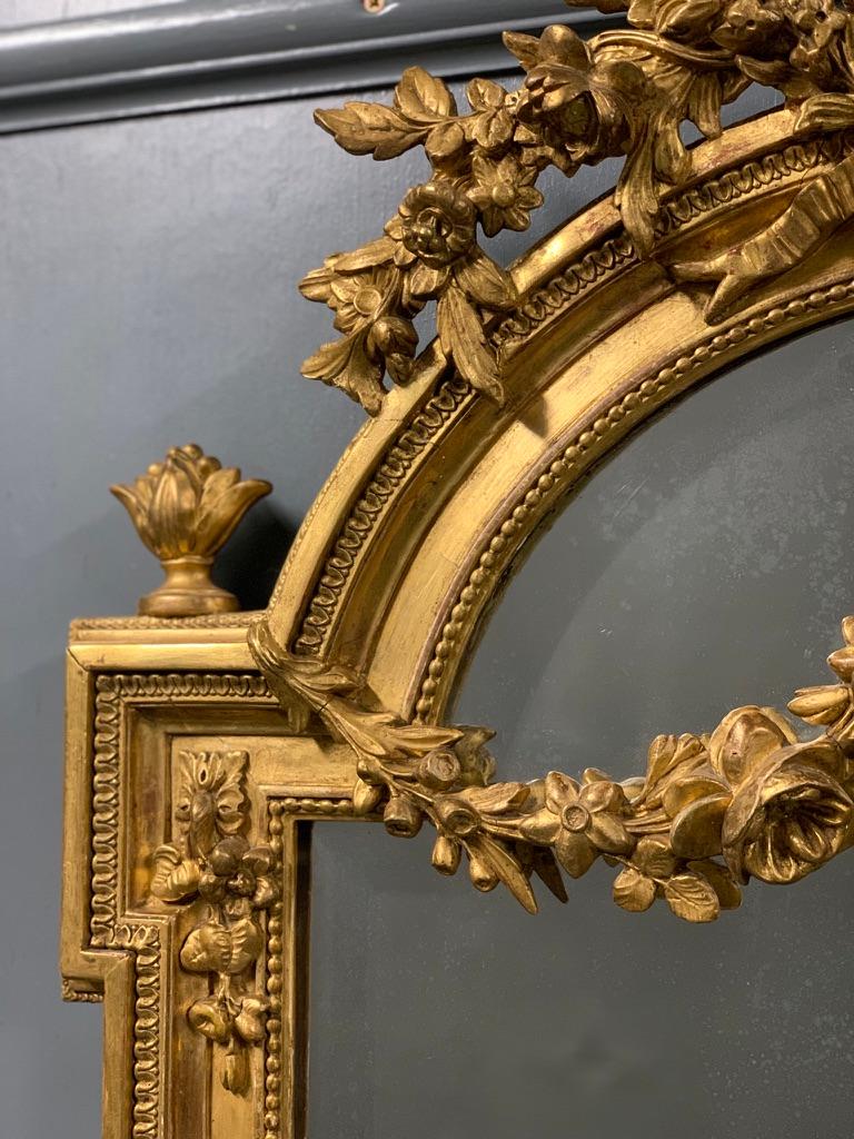 An exceptional quality and beautiful condition French gilt Louis xvi style mirror, circa 1880.
Fabulous detail throughout the frame and garlands draped over the original mercury bevelled mirror plate.
The mirror has aged very gracefully, so it has