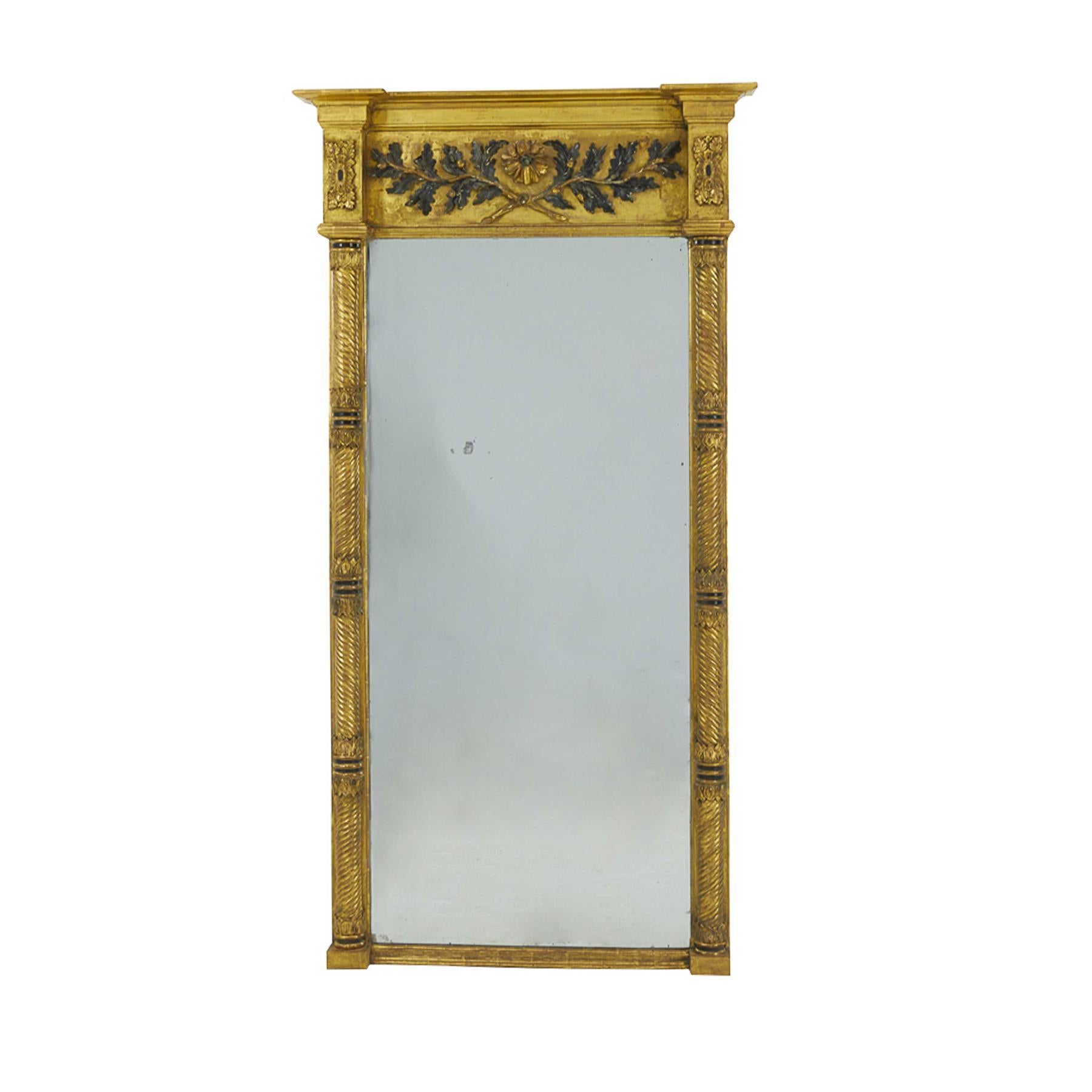 A stunning 1830s English pier mirror with carved decoration and wonderful gilding.
