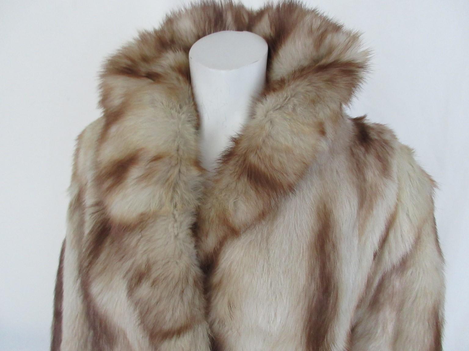This coat is made of quality Skandinavian fitch fur.

We offer more luxury fur items, view our front store

Details:
With 2 closing hooks
2 pockets 
Fully lined
Matching fur belt
These coats are rare to find!
Can be worn unisex by men and