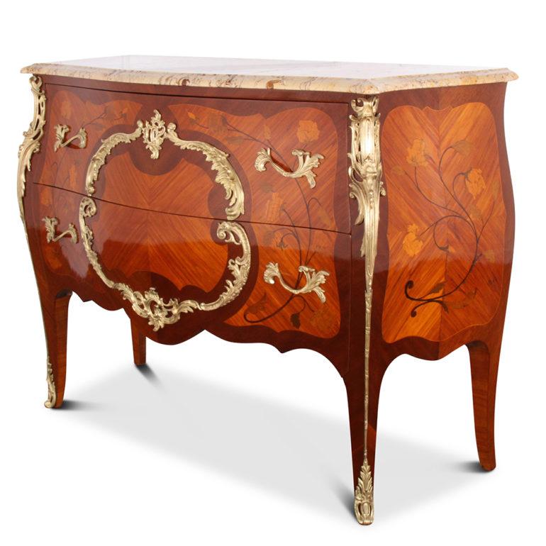 Beautifully detailed Louis XV style ‘bombe’ commode in kingwood with a variety of exotic wood inlays and highly detailed gilt bronze mounts, circa 1900.



          