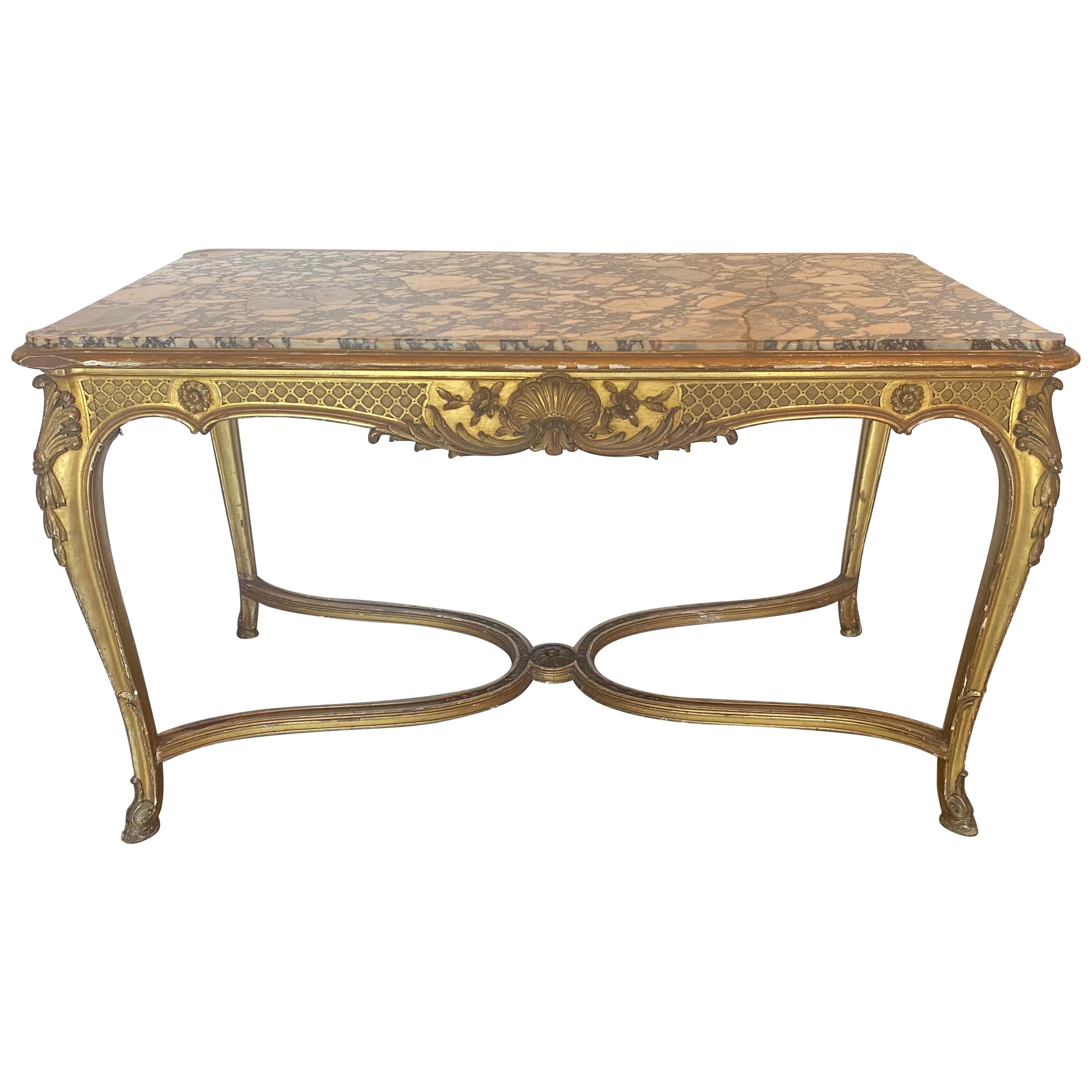 Exceptionnelle table de style Louis XV à plateau en marbre doré