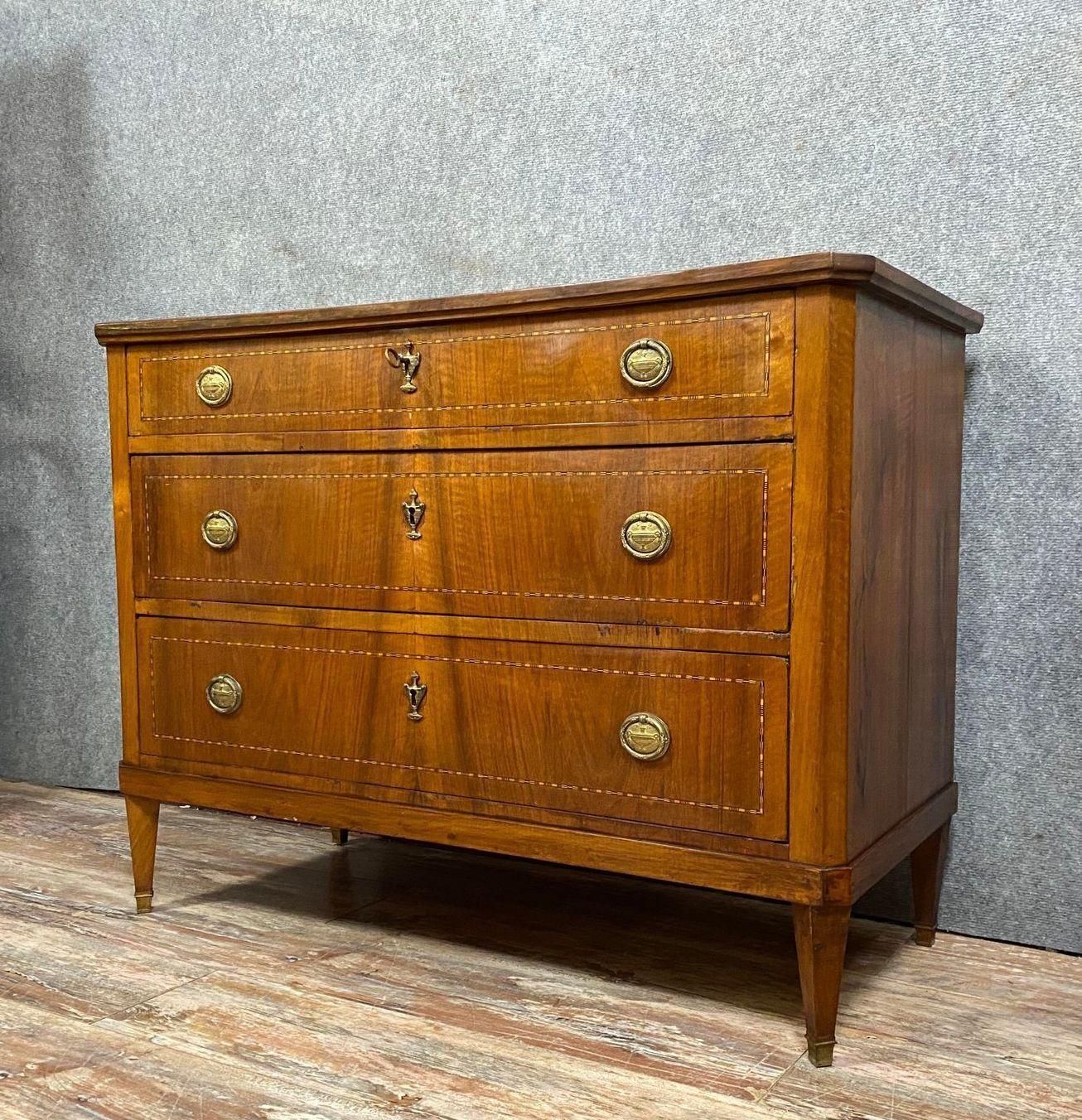 Step into the grandeur of the 19th century with this exceptional Louis XVI mahogany and marquetry commode, crafted around 1850. This exquisite piece exudes timeless elegance and impeccable craftsmanship, reflecting the opulence of the Louis XVI