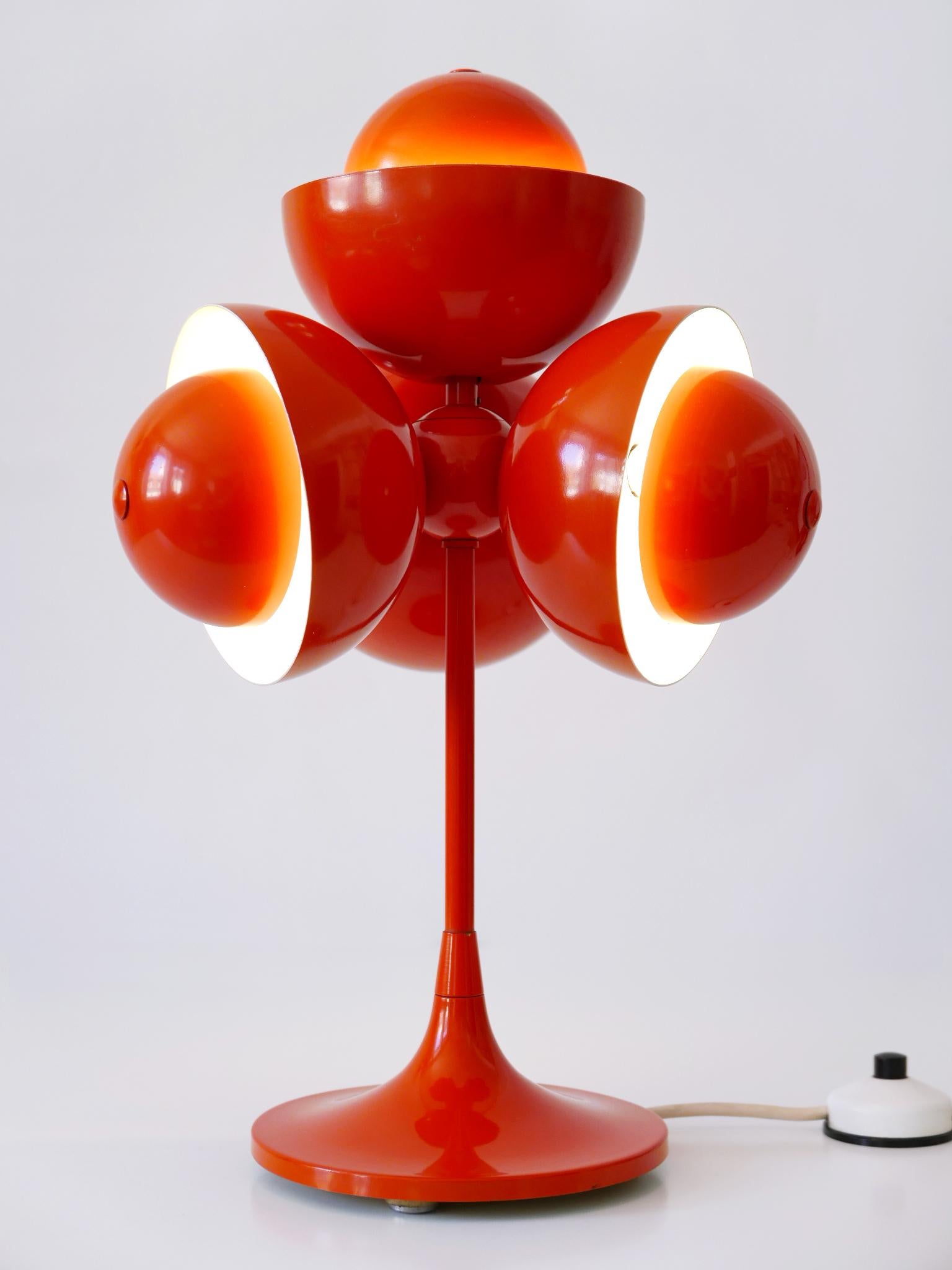 Extremely rare & highly decorative Mid-Century Modern flowerpot table lamp. Designed & manufactured probably in Germany, 1970s.

With 3-stage lighting option: only top or only three or all four.

Executed in white & orange painted aluminium and