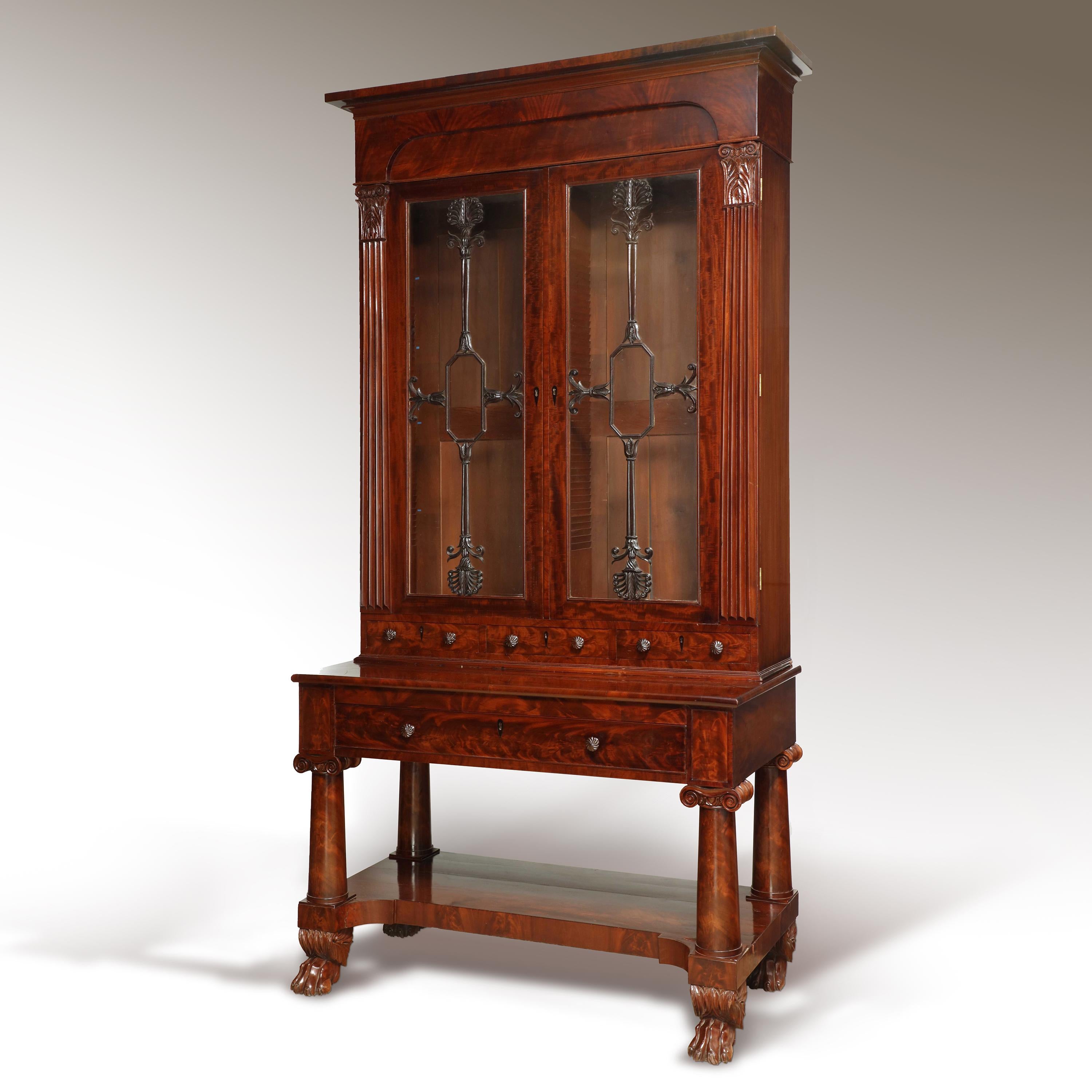 Mahogany bureau bookcase from Baltimore, Maryland of exceptional quality. Design is most like examples from shop of John Needles while tapering columnar supports and finely carved elements on doors are most closely compared to Anthony Jenkins. Circa