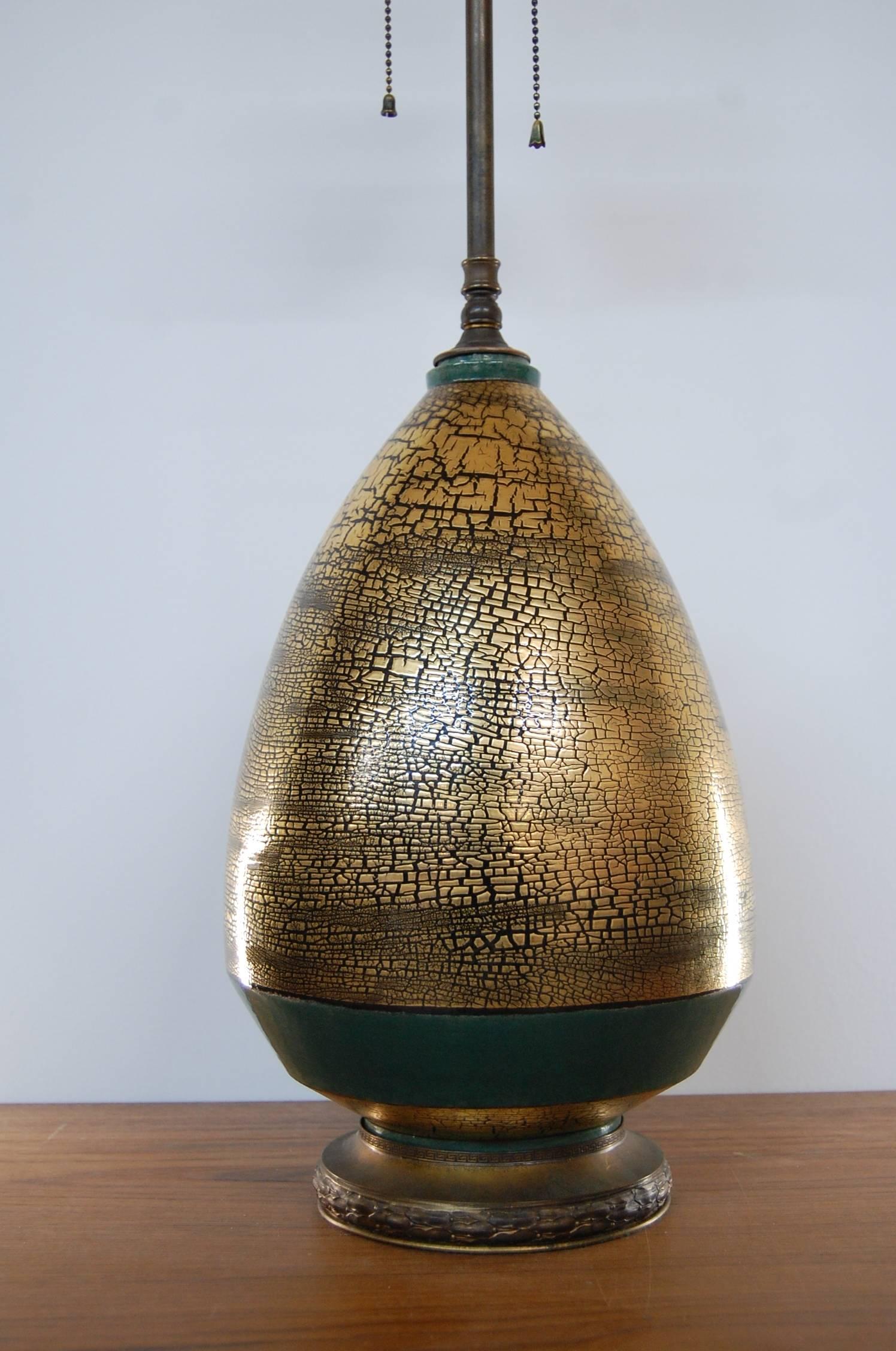 Exceptional and large Marcel Guillard table lamp, circa 1930, in excellent original condition. Appears to wear its original brass hardware, including the base, as well as the original ceramic finial, most likely also designed by Wuilleumier and