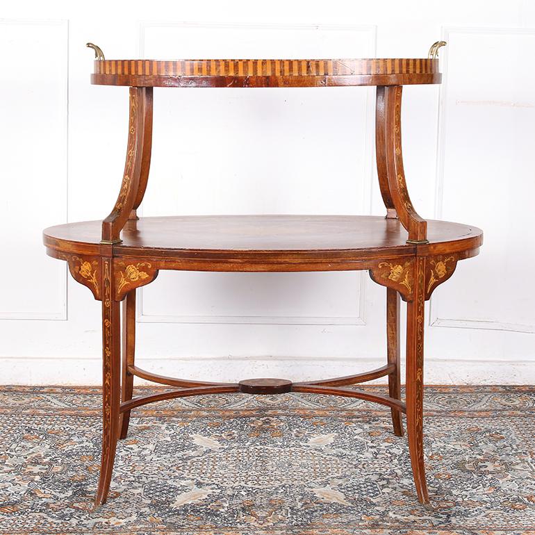 Exceptionally inlaid, fine serving two tier table from England from the most elegant of English homes.  The entire piece is painstakingly covered with inlay.

Dimensions: 
W: 35″
D: 20″
T: 34″