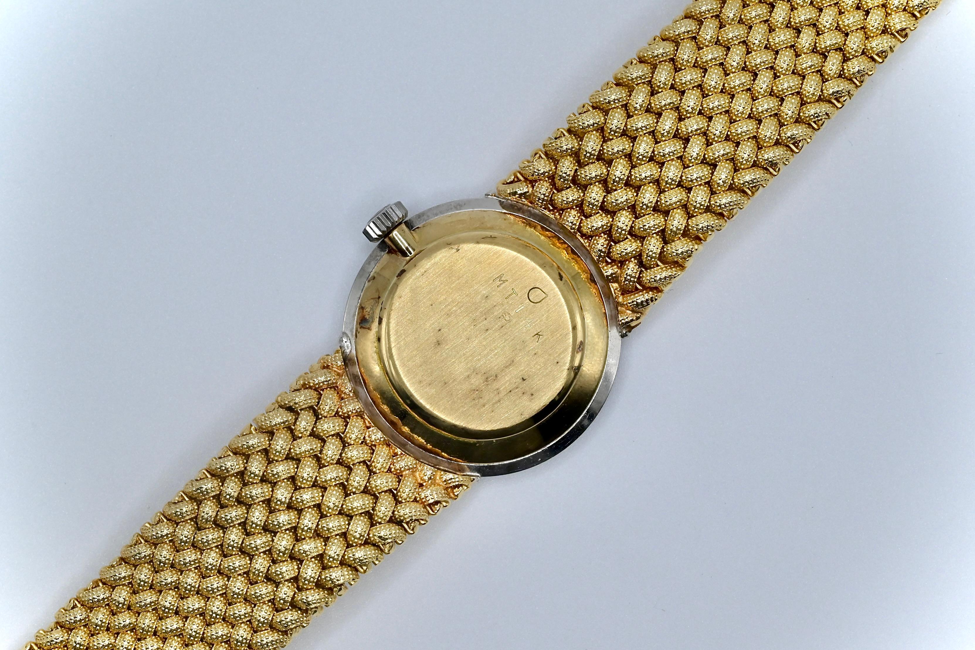 gold mathey tissot watch