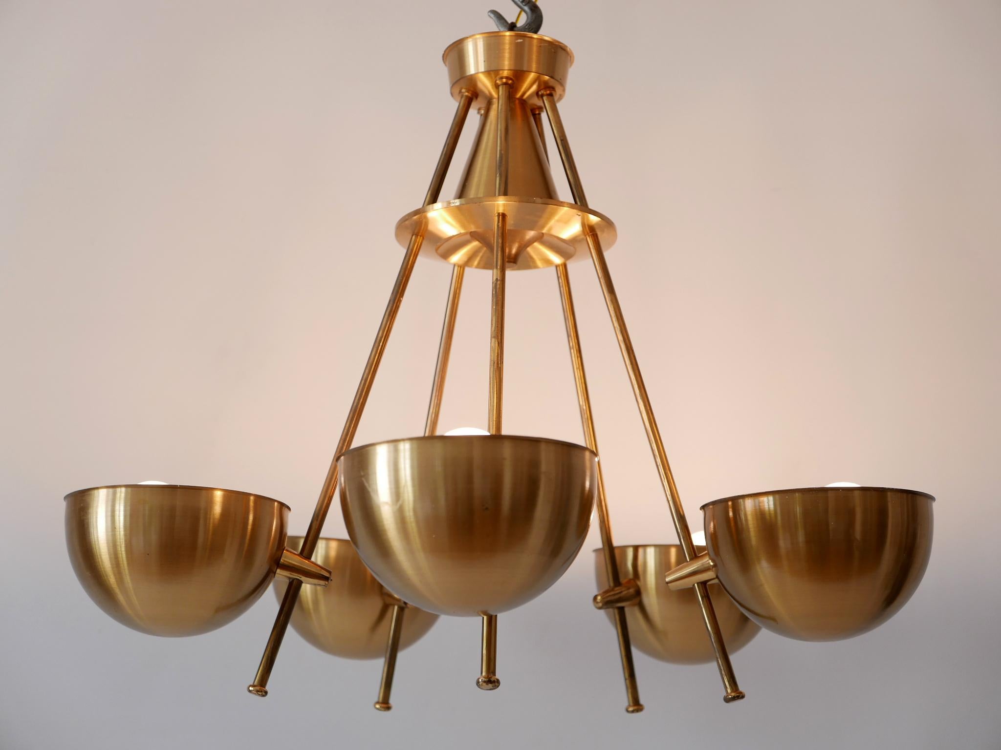 Extremely rare, lovely and highly decorative Mid-Century Modern five-flamed pendant lamp or chandelier. Designed and manufactured probably in Sweden, 1950s.

Executed in brass, the pendant lamp / chandelier comes with 5 x E27 / E26 Edison screw fit