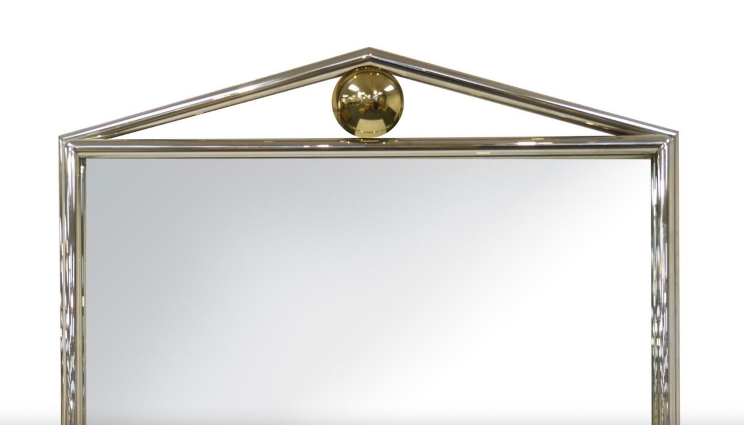 Elevate your decor with this Exceptional Mid-Century Modern Chrome Framed Mantel Mirror, a piece that seamlessly blends bold, clean lines with striking design elements, creating a captivating focal point for your living space. The mirror's