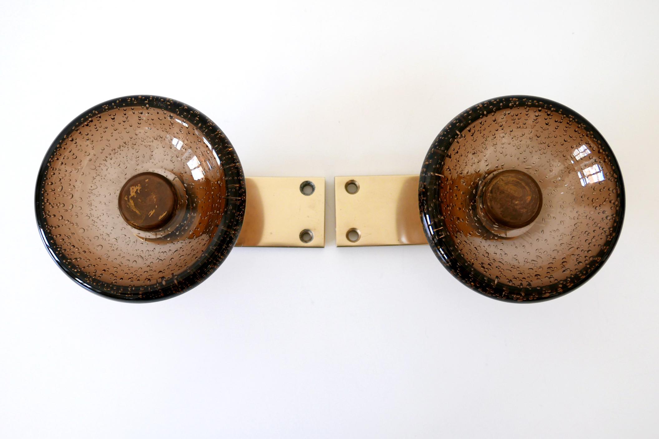 Extremely rare & elegant Mid-Century Modern double push & pull door handles. Murano glass with air bubbles. Designed and manufactured probably by Seguso, Murano, Italy, 1960s.

Executed in Murano glass, brass and gold anodized