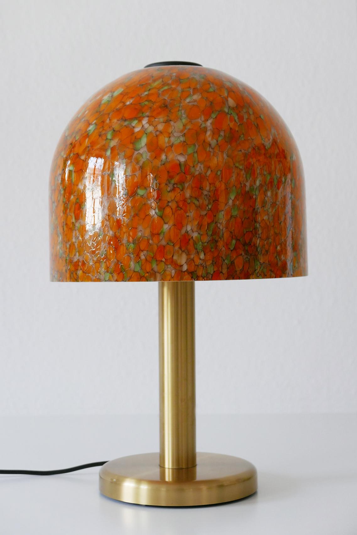 Rare and elegant Mid-Century Modern table lamp by Peill & Putzler, Germany, 1970s.

Executed in glass and brass. The lamp needs 1 x E27 Edison screw fit bulb, is with original wiring, and in working condition. It runs both on 110 / 230