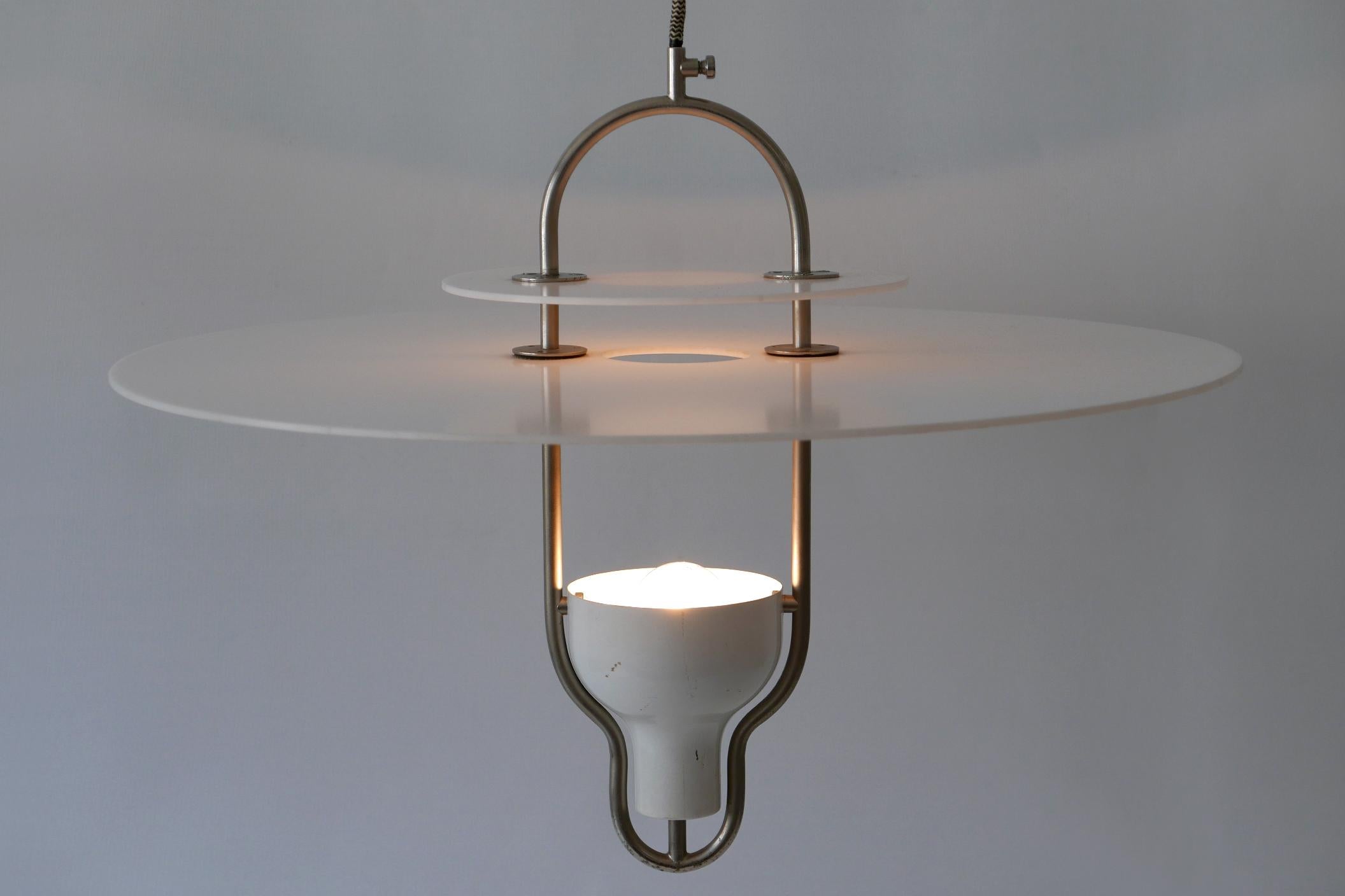 Extremely rare and elegant Mid-Century Modern pendant lamp. Manufactured probably in Italy, 1960s.

Executed in two white plexiglass discs and nickel-plated steel, the pendant lamp needs 1 x E27 / E26 screw fit bulb. It works both with 110 / 230