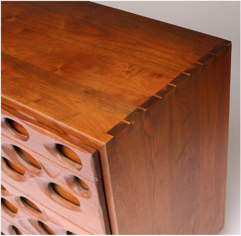 For your consideration is this beautiful New Hope School credenza made of black Walnut featuring 4 drawers and one door reveiling one shelf. Handcrafted cabinet with applied sculpted front by Gino Russo (a long time apprentice to Nakashima). This