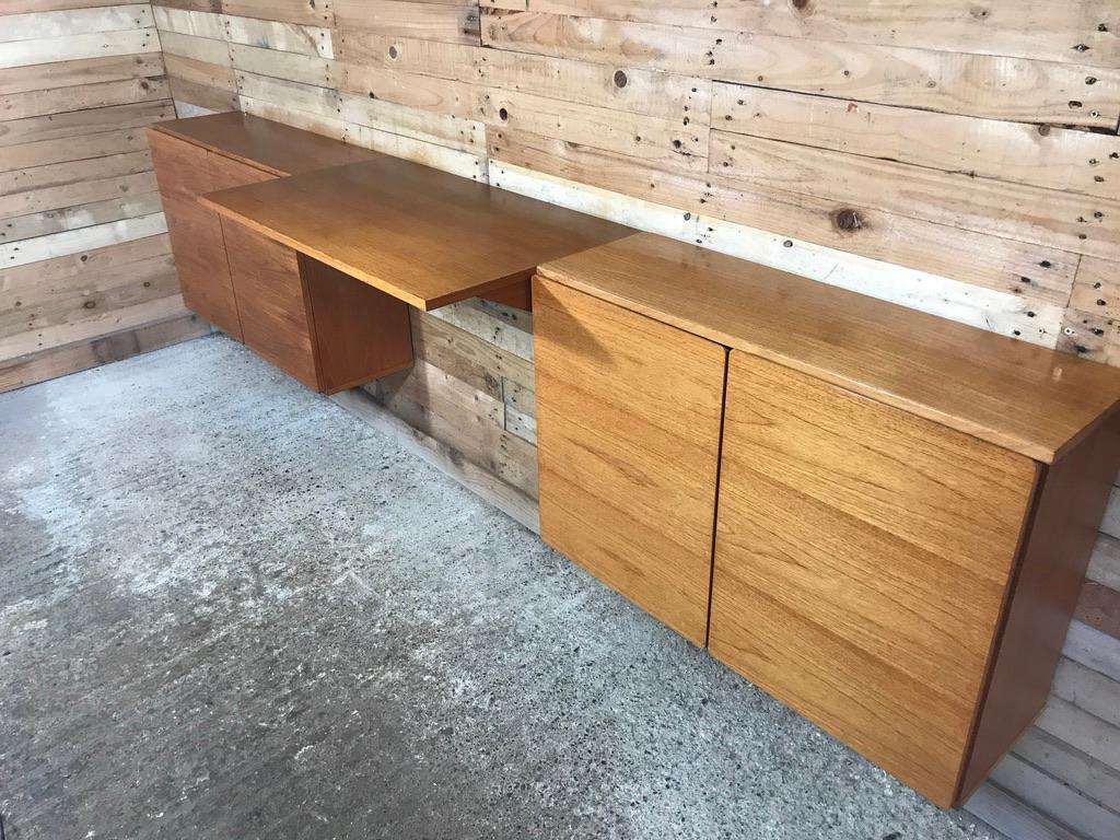 Totally free-hanging large teak 1960 retro desk, super minimalistic. it has a large desk and two cupboards. Height can be adjusted as required, it is very easy to fix to the wall (with metal or wooden wall brackets which are all included!) .

We
