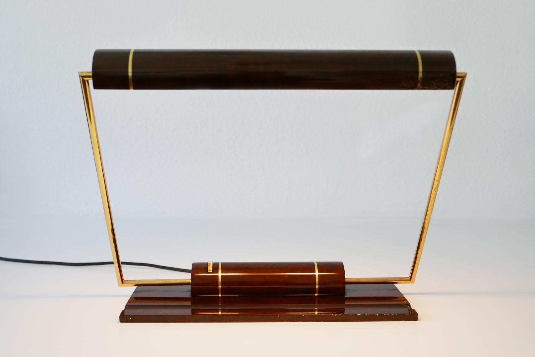 Extremely rare, big Mid-Century Modern banker desk light or table lamp. Designed and manufactured by George Kovacs, 1980s, USA.

Executed in partly enameled brass. The lamp needs 2 x 7 W / 41 Osram Delux S bulbs, is with original wiring and in