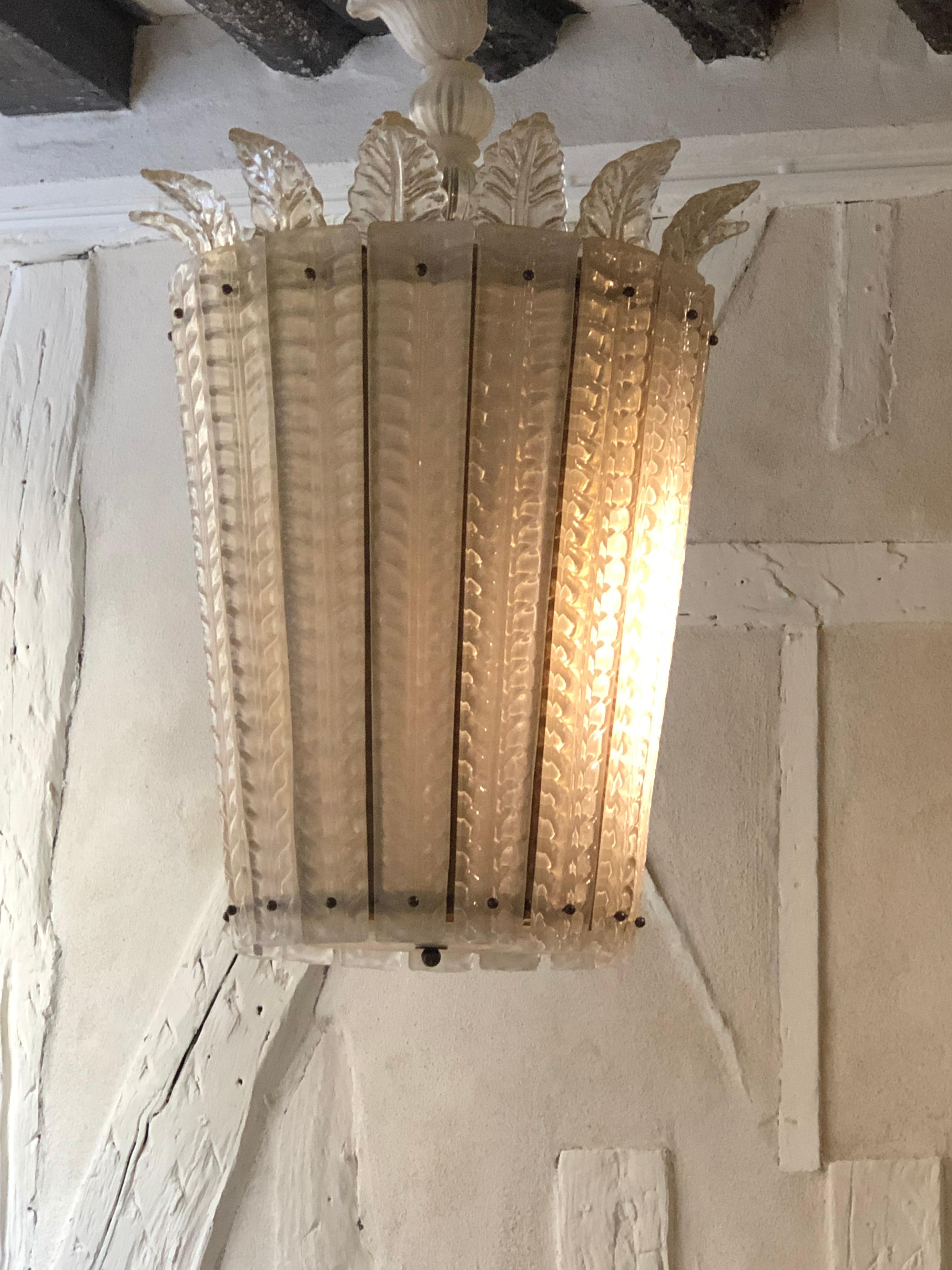 Absolutely gorgeous contemporary large lantern made with original vintage Murano glass from the 1950s. The lattimo (translucent milk glass) white / with gold inclusion carved plaque in the shape of braid (like stylized palm leaves) and a crown of