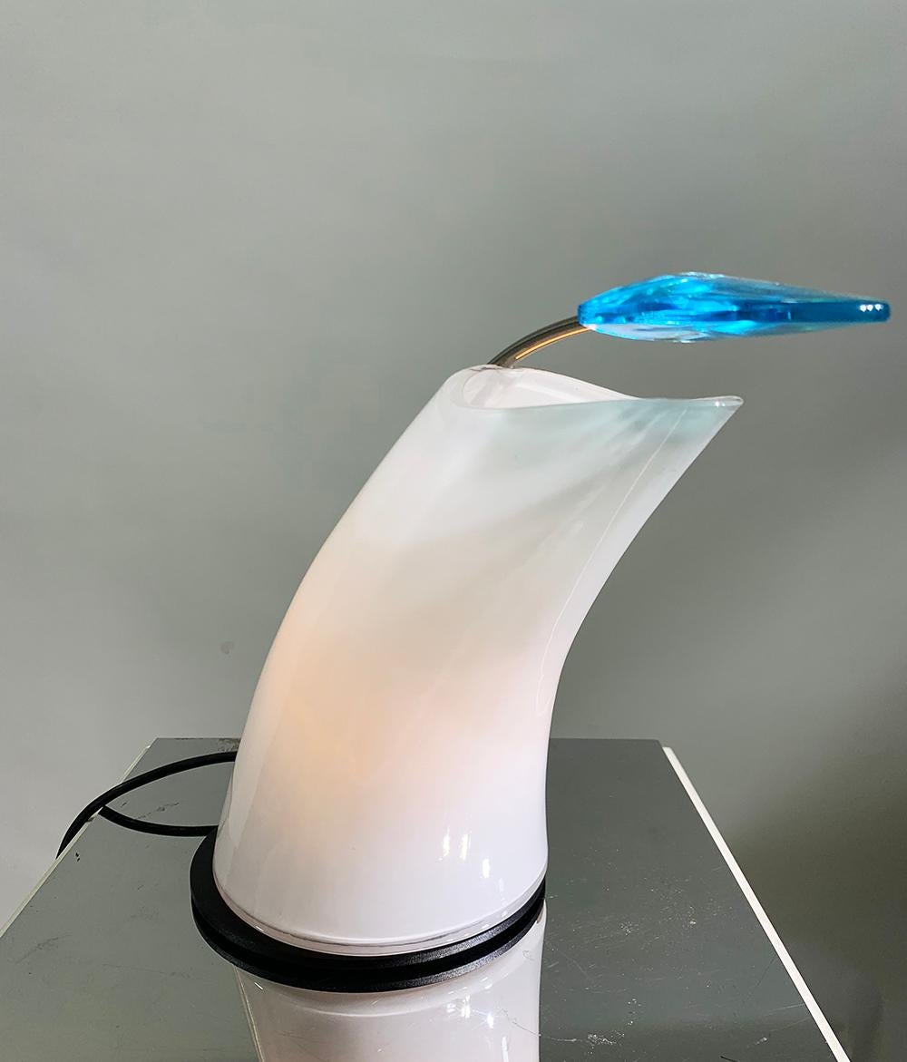 Rare Blue and white Murano glass table lamp designed by Carlo Nason and manufactured in the 1960s by Murano glassmaker A.V. Mazzega having a Black metal base with mesh milk glass lampshade.
Equipped with light switch and dimmer
Original label: AV