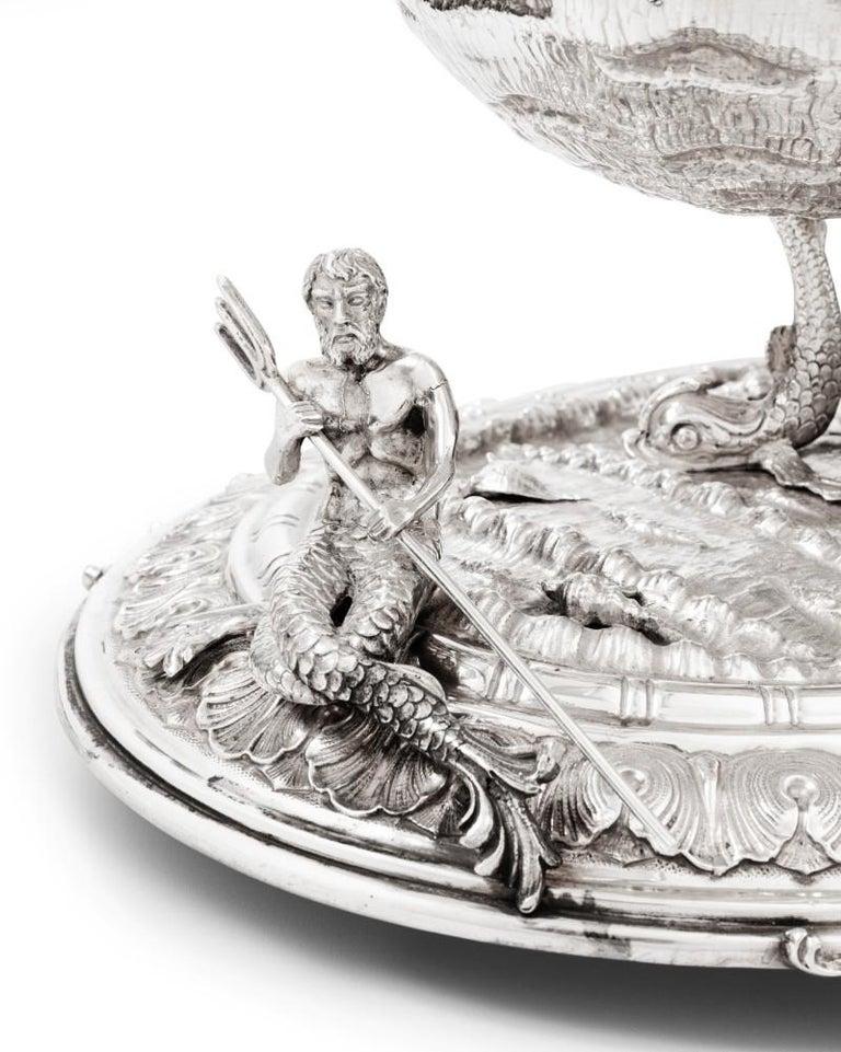 Exceptional nautical themed silver centerpiece by Buccellati

A silver masterpiece depicting: putto, leaves, neptune holding a trident, shell, and dolphins by master silversmiths Buccellati

The perfect centerpiece for a dinner table.

Made