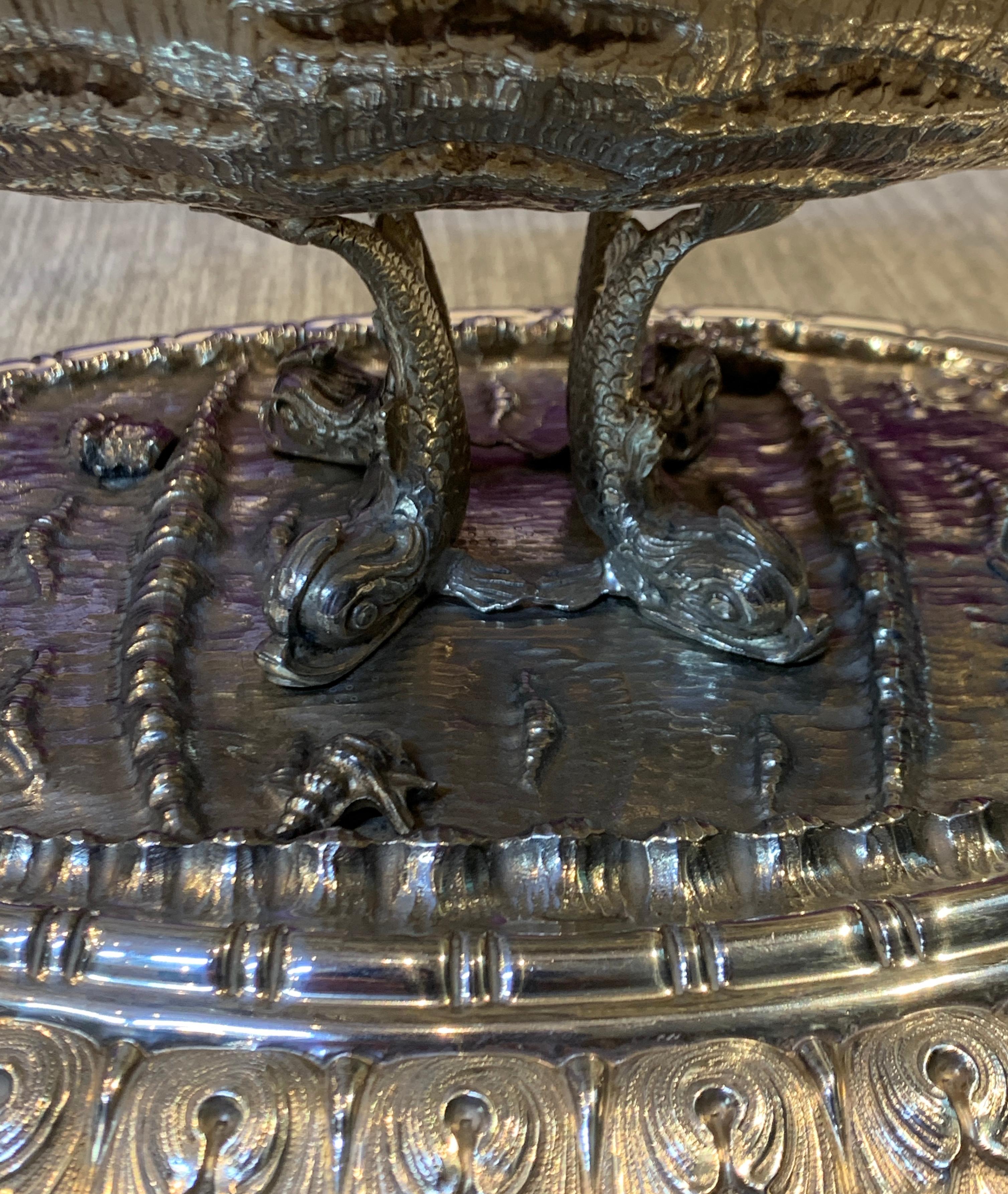 Exceptional Nautical Themed Silver Centerpiece by Buccellati

A silver masterpiece depicting: putto, leaves, Neptune holding a trident, shell, and dolphins by master silversmiths Buccellati

The perfect centerpiece for a dinner table.

Made Circa