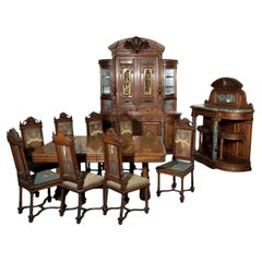 Exceptional Neo-Renaissance style dining room set made out of carved walnut.