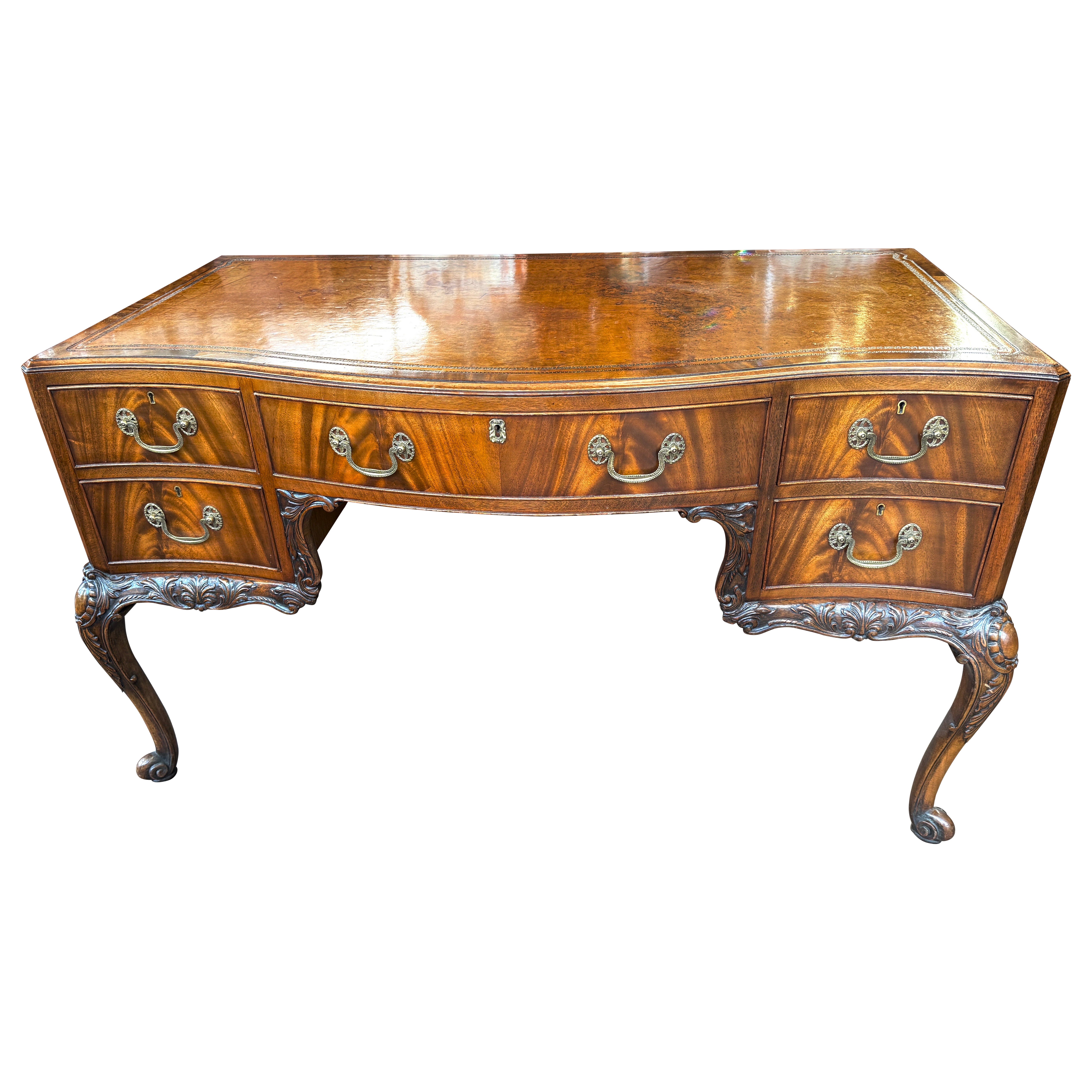 Exceptional Old English Hand Carved Mahogany Serpentine leather-top Desk For Sale