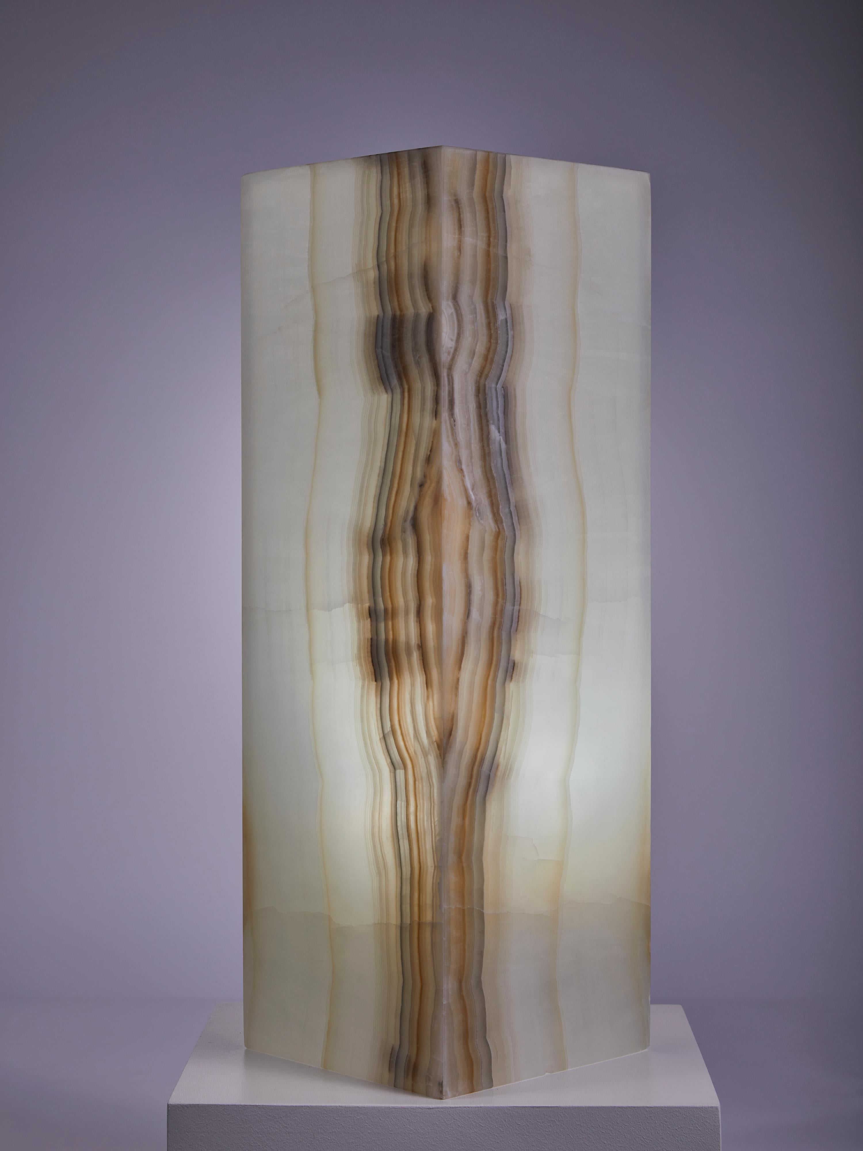 Beautiful lamp, carved from a block of translucent Mexican banded onyx.


