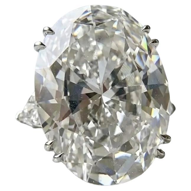 Exceptional Oval Brilliant Diamond Ring with Trillion Accents – Platinum For Sale