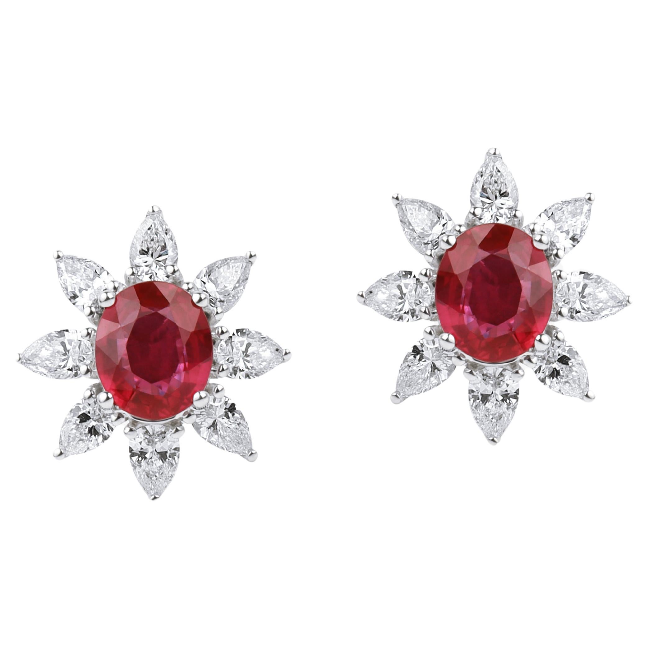 Exceptional oval natural ruby diamond stud earrings, halo diamond in 18k gold For Sale