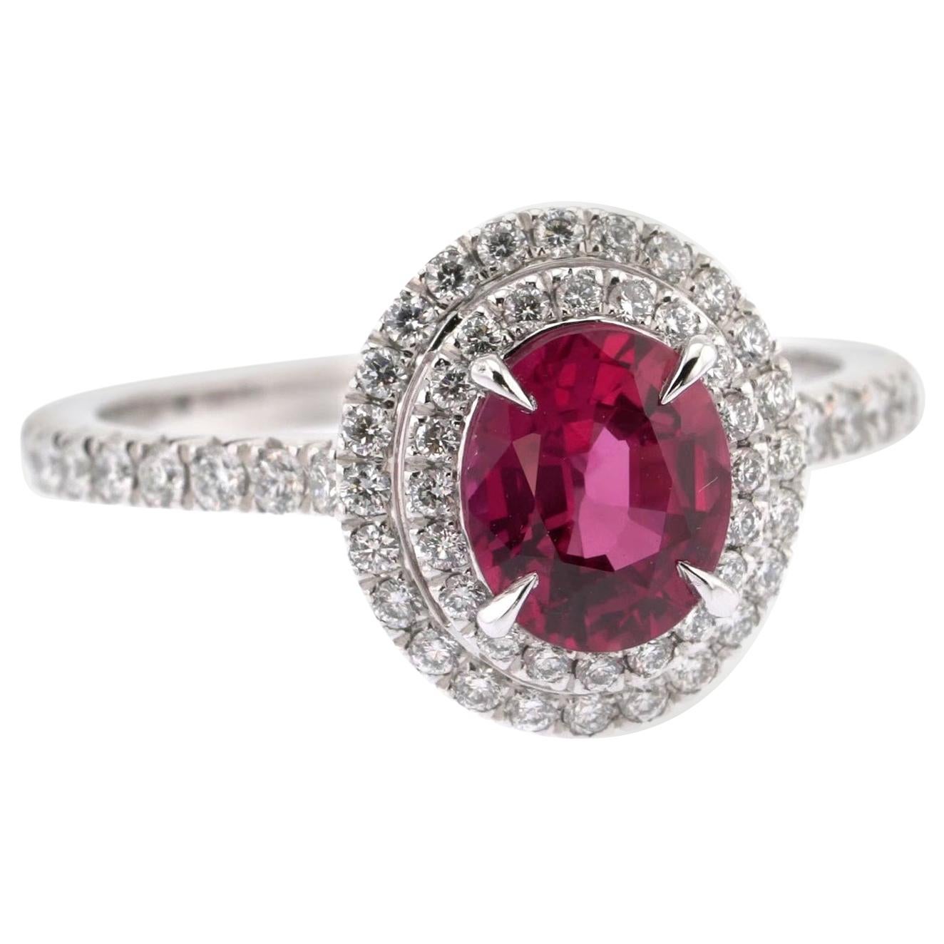 1.18 Carats Oval Ruby and White Diamonds Double Halo Ring For Sale