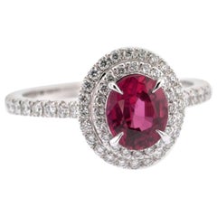 1.18 Carats Oval Ruby and White Diamonds Double Halo Ring