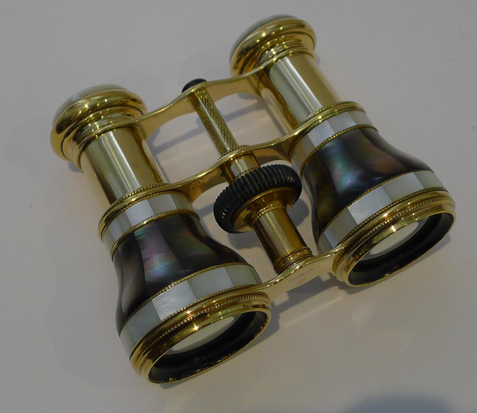 A stunning and rarely found pair of exceptional French Opera Glasses, beautifully made with lots of detail and the outstanding combination of Mother of Pearl and Abalone Shell.

They are beautifully signed on the underside for the top notch maker,