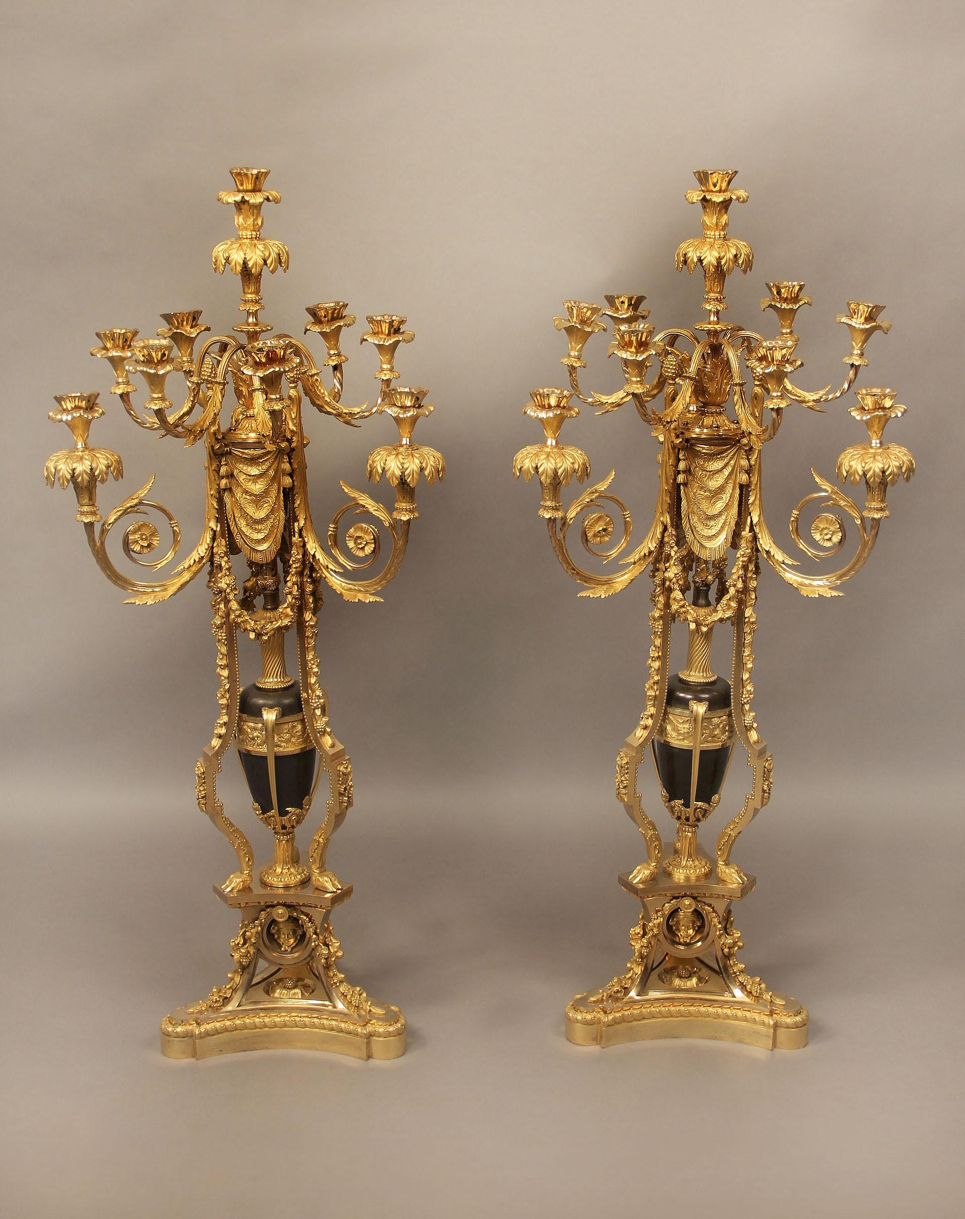 An Exceptional Pair of Late 19th Century Napoleon III Gilt Bronze and Enamel Ten Light Candelabra

Attributed to Maison Beurdeley

The ten candle foliate designed branches with leaf drip pans, centered with an enamel vase and a gilt band with