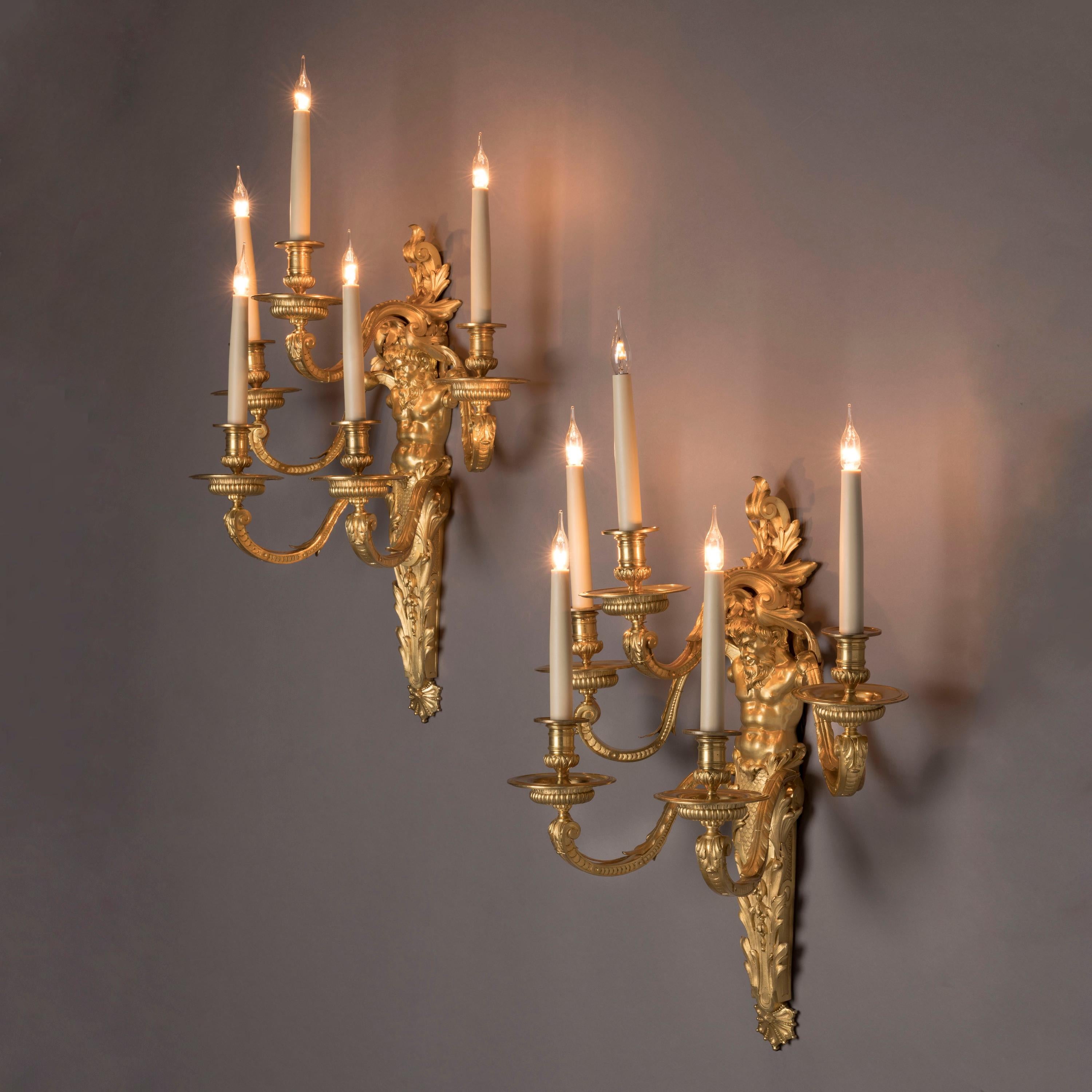 An Important Pair of Louis XIV Style Wall Appliques By Henry Dasson of Paris

Of the highest quality and retaining its original fire gilded finish with burnished highlights, each wall applique modelled as a bearded male herm emerging from a