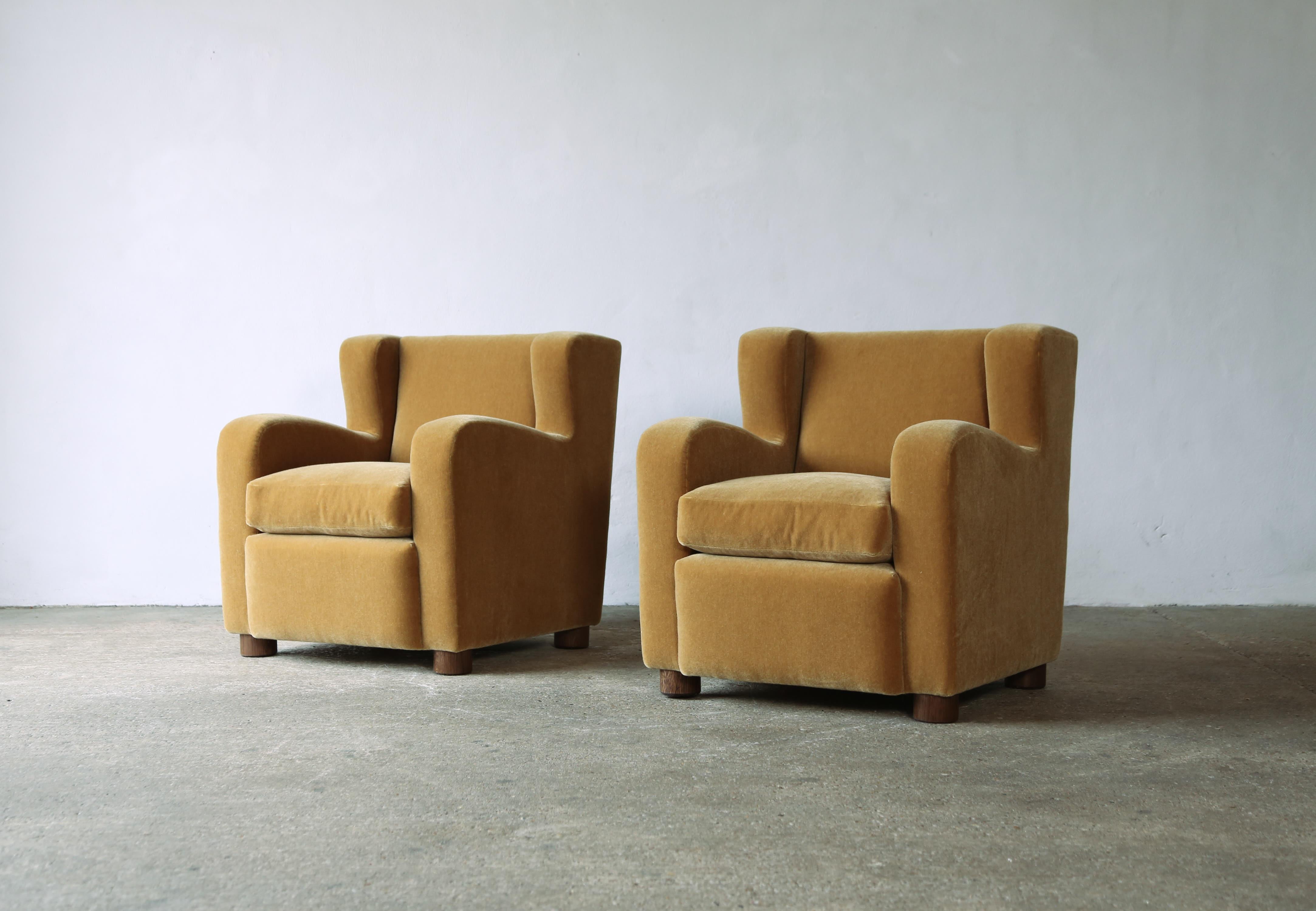 A superb pair of modern armchairs.  Newly upholstered in a premium, soft, pure mohair fabric with a feather cushion solid oak feet.   Also available in COM.  Handmade in England.  Fast shipping worldwide.



