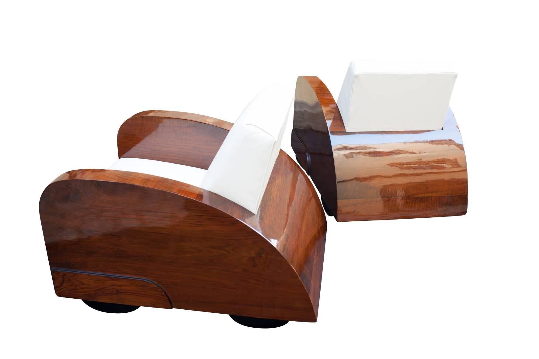 Original 1920s Art Deco club chairs built in the shape of two cars.

Inspired in its form by the Bugatti 