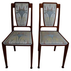 Antique exceptional pair of Art Deco side chairs with inlay and recovered elegant tissus