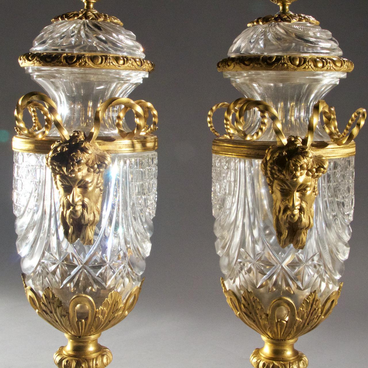 Fine pair of gilt bronze-mounted crystal vases with covers, attributed to Baccarat.