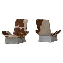 Exceptional pair of cowhide Lounge chairs